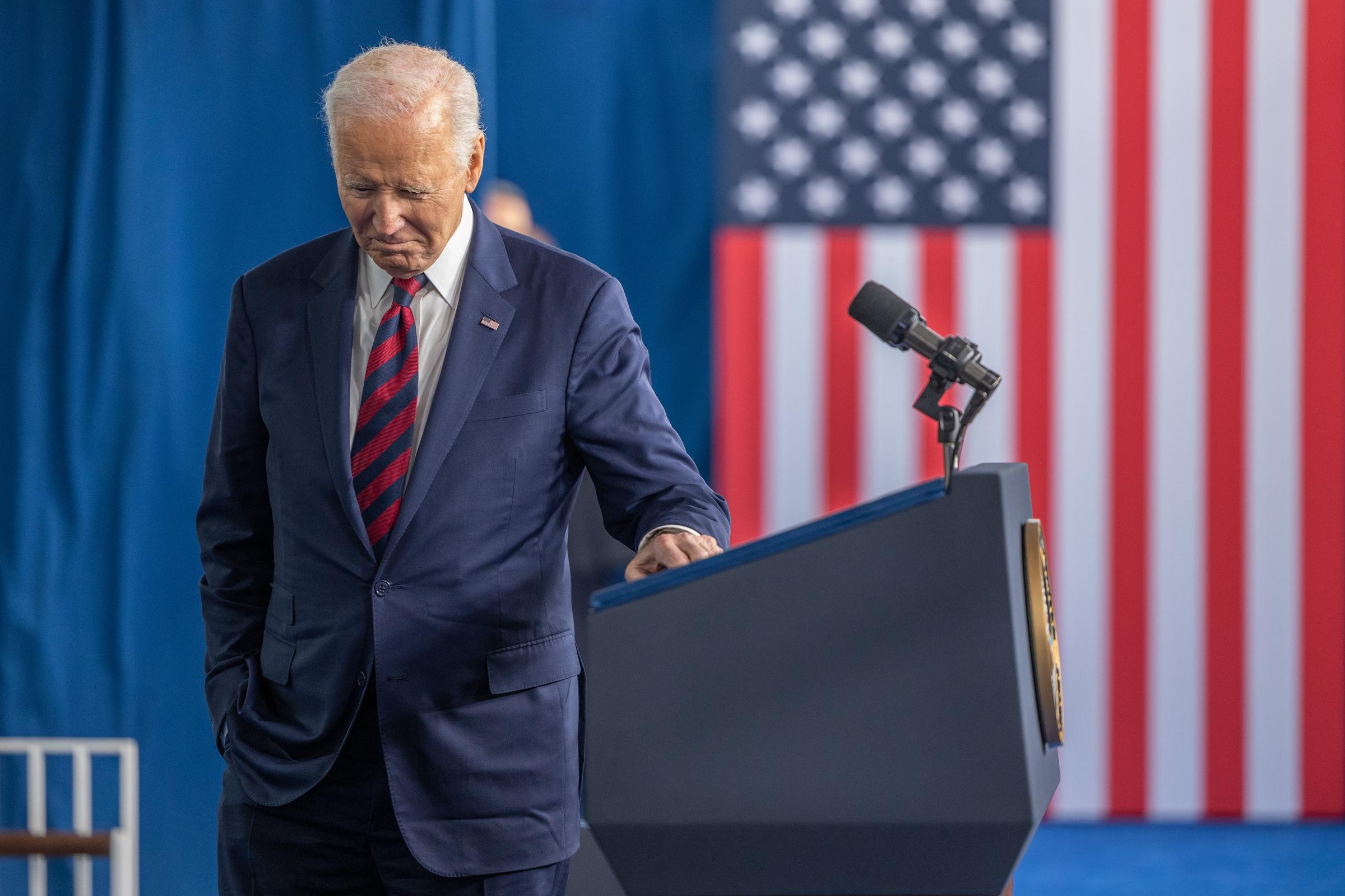 Joe Biden pauses for a moment as a gospel choir sings before addressing attendees at the International African-American Museum on January 19, 2025, in Charleston, South Carolina. | Source: Getty Images