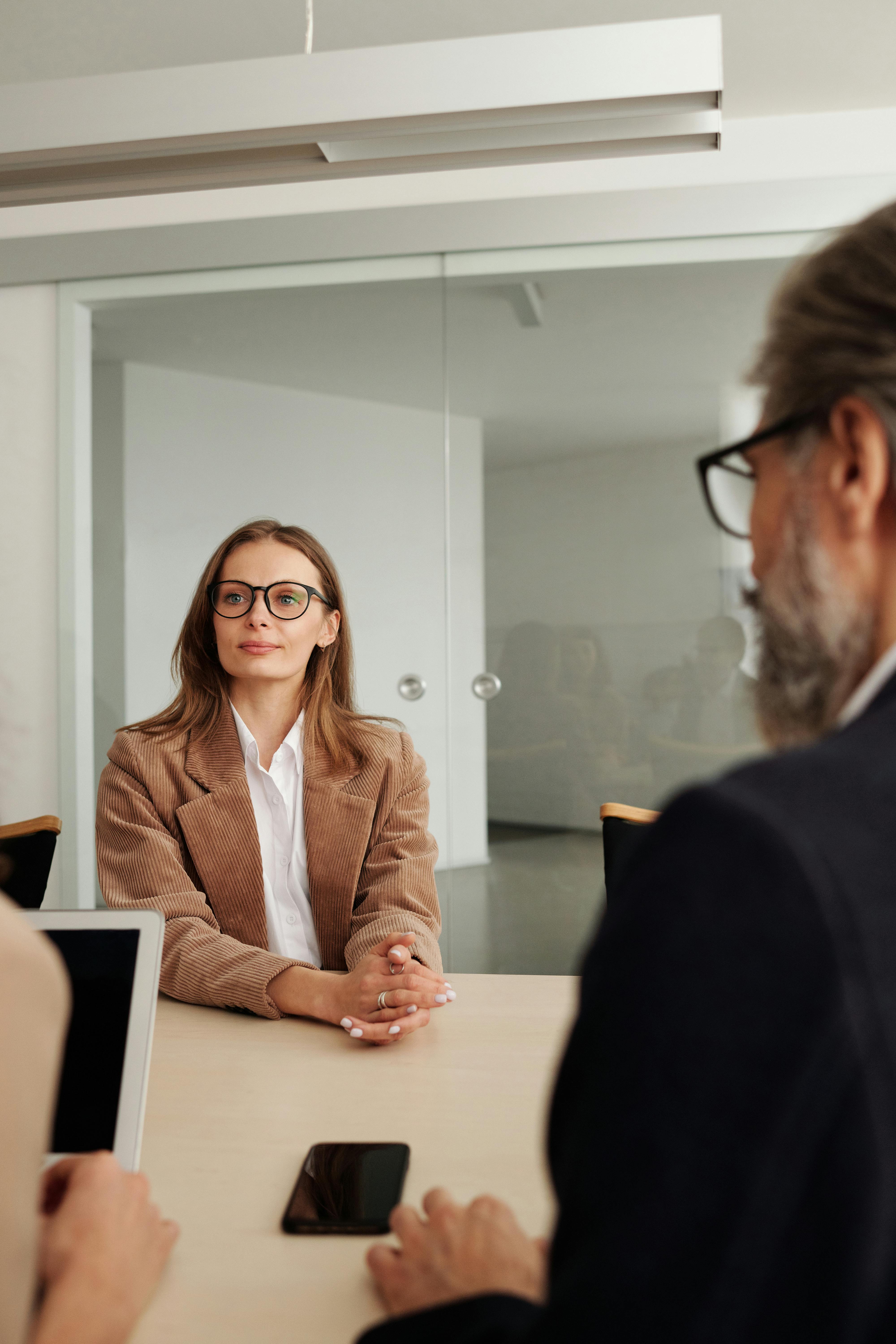 A woman sitting in an office | Source: Pexels
