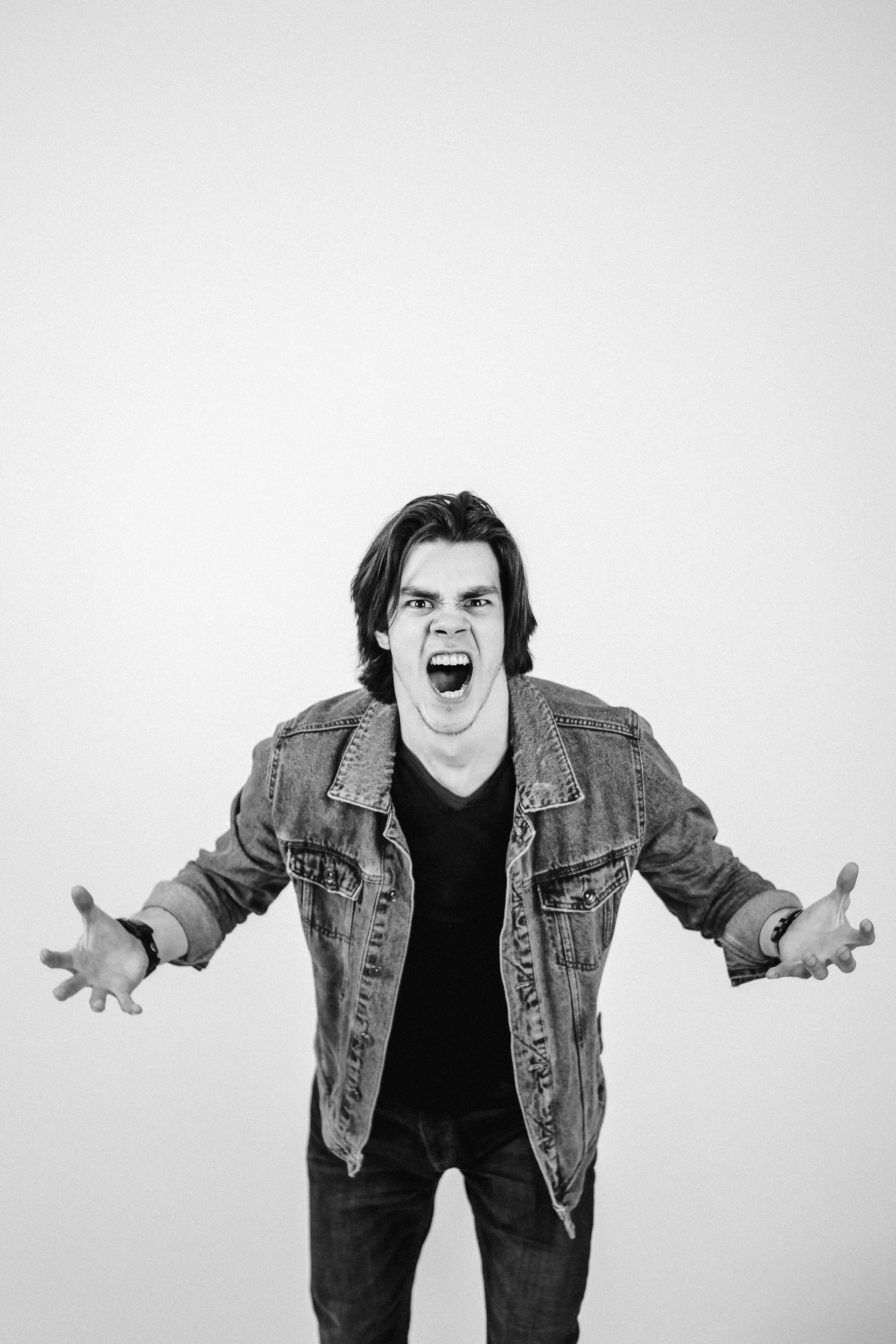 A man speaking angrily | Source: Unsplash