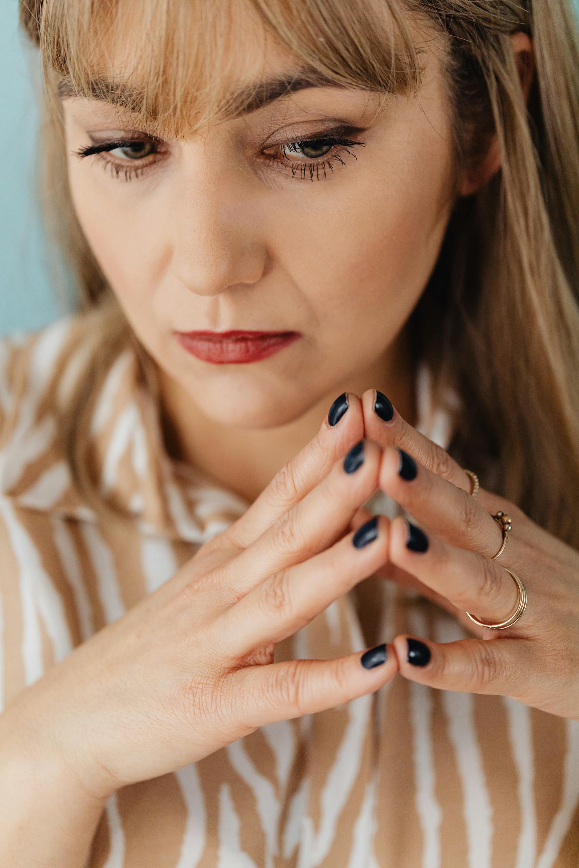A tense and thoughtful woman | Source: Pexels