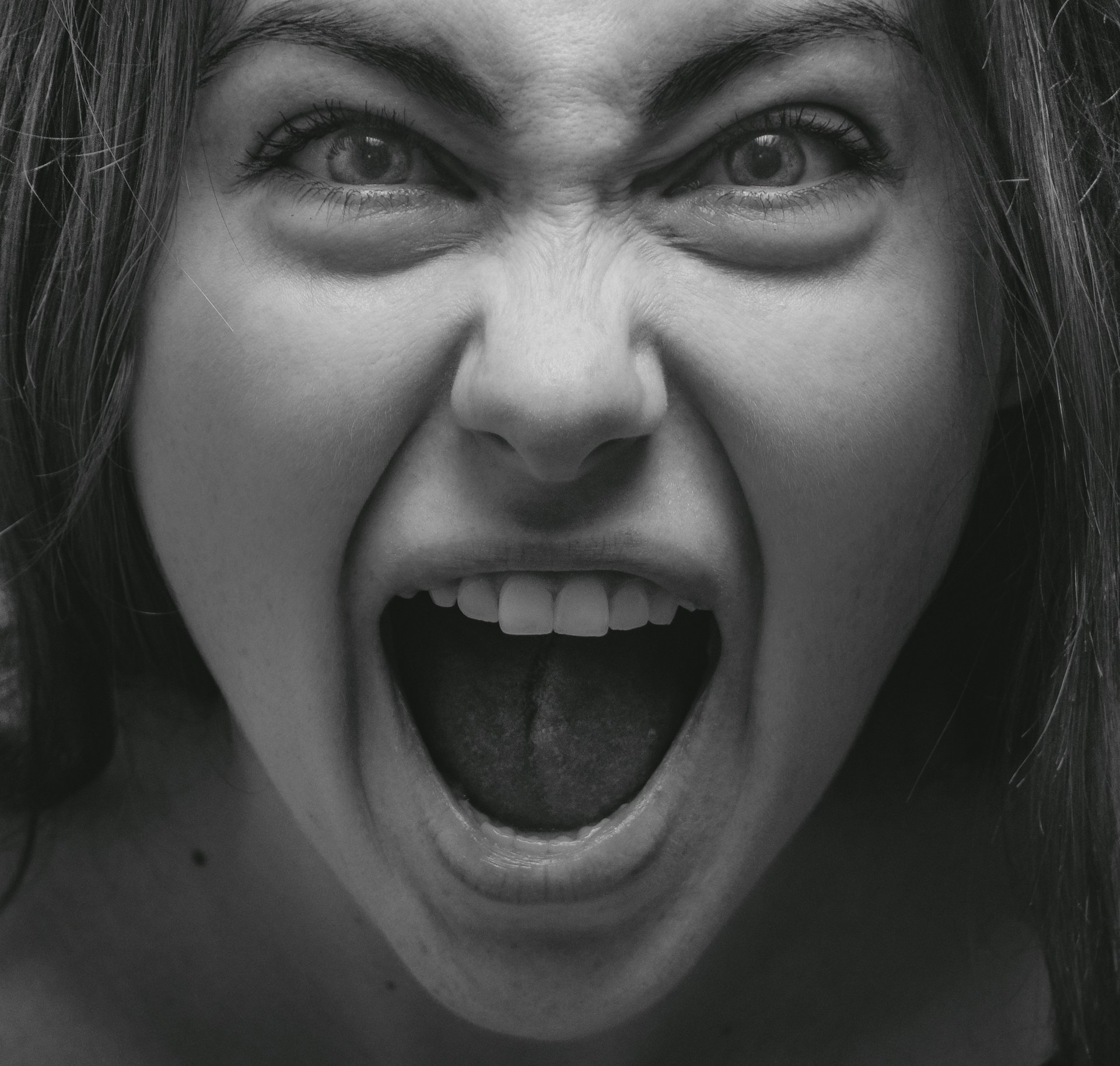A woman shouting | Source: Unsplash