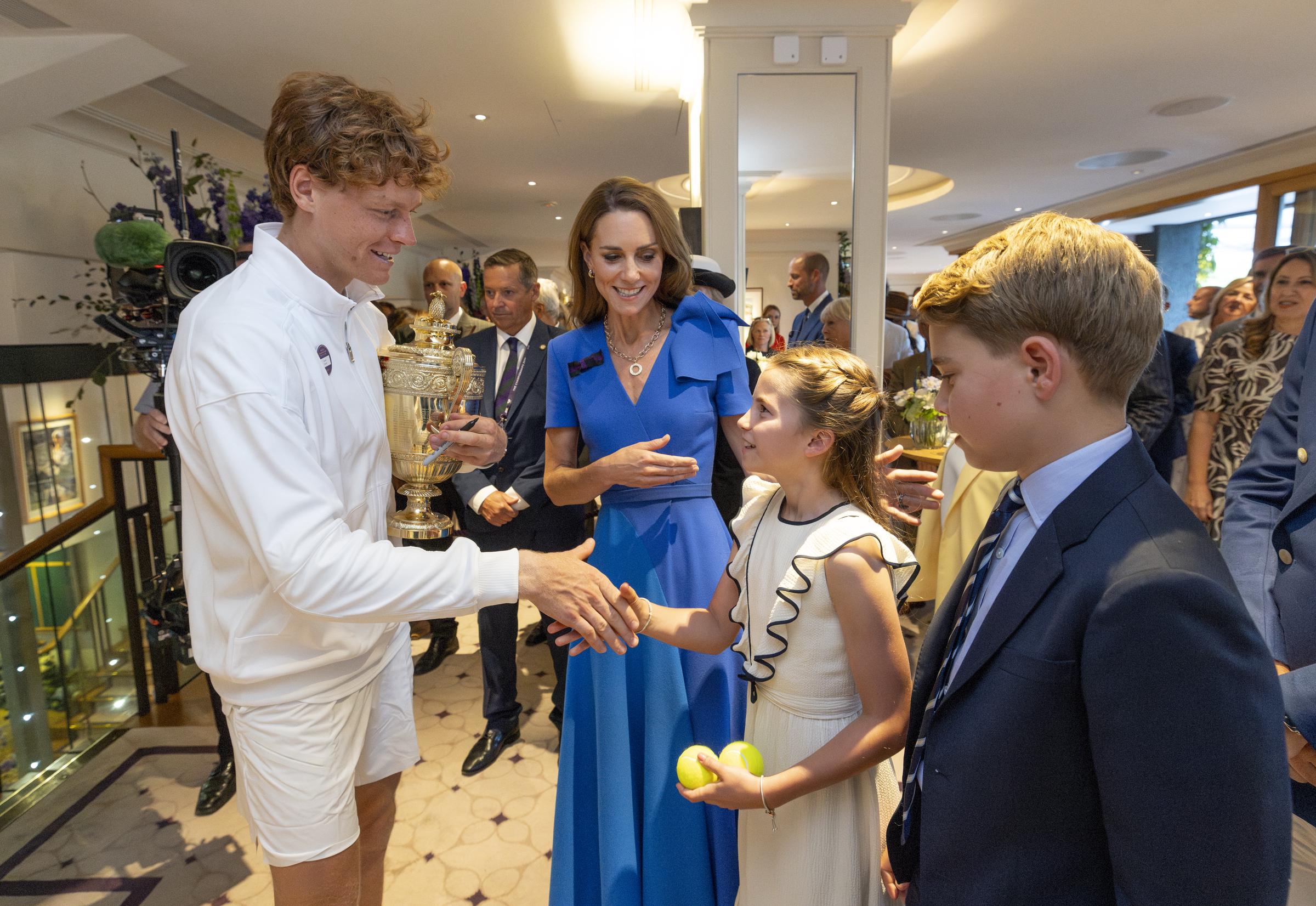 Jannik Sinner shakes hands with Princess Charlotte, alongside Catherine, Princess of Wales, and Prince George in the clubhouse after winning the 2025 Wimbledon final at the All England Lawn Tennis Club on July 13, 2025 in London, England | Source: Getty Images