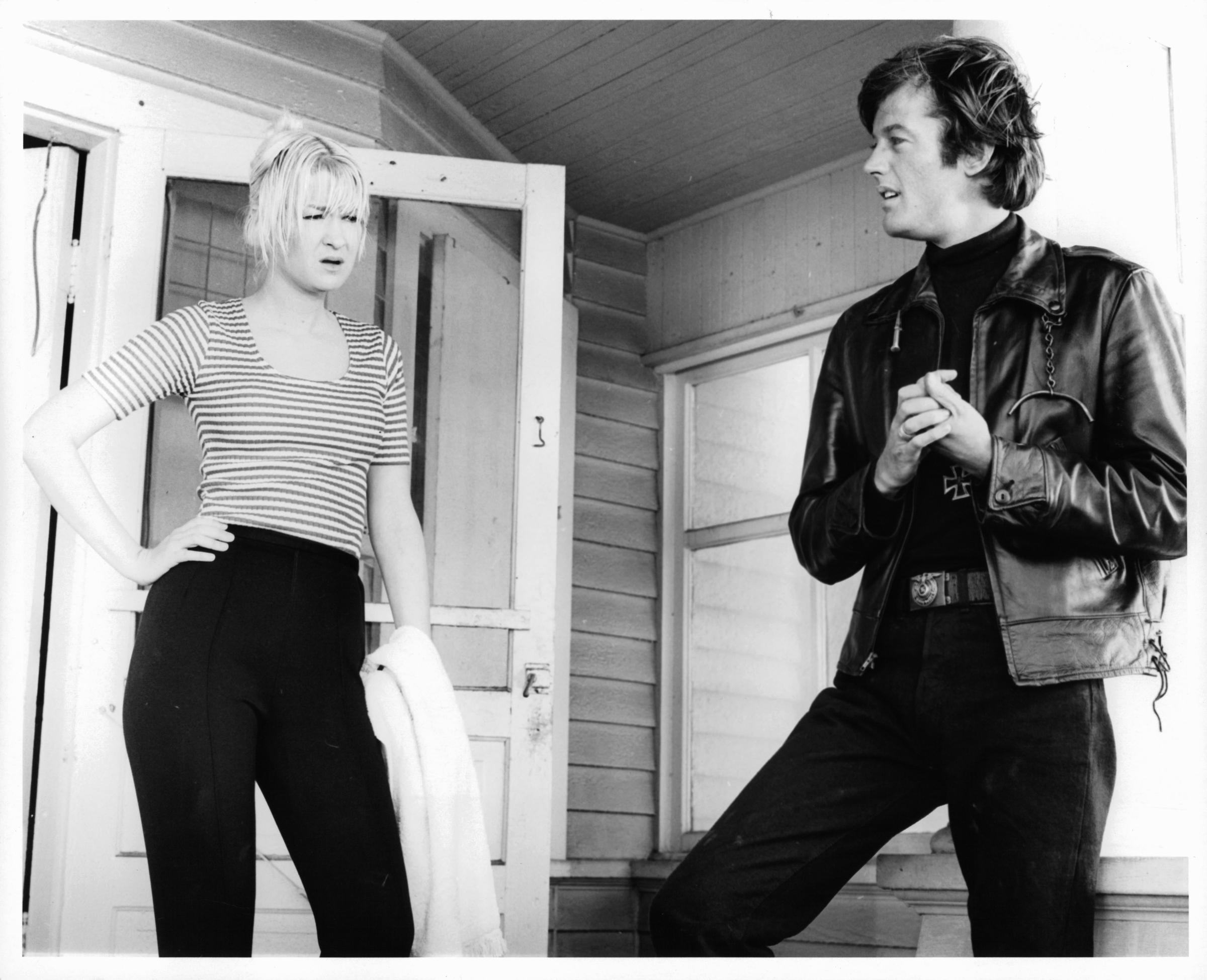 Diane Ladd and Peter Fonda standing on porch in a scene from the film "The Wild Angels," circa 1966. | Source: Getty Images