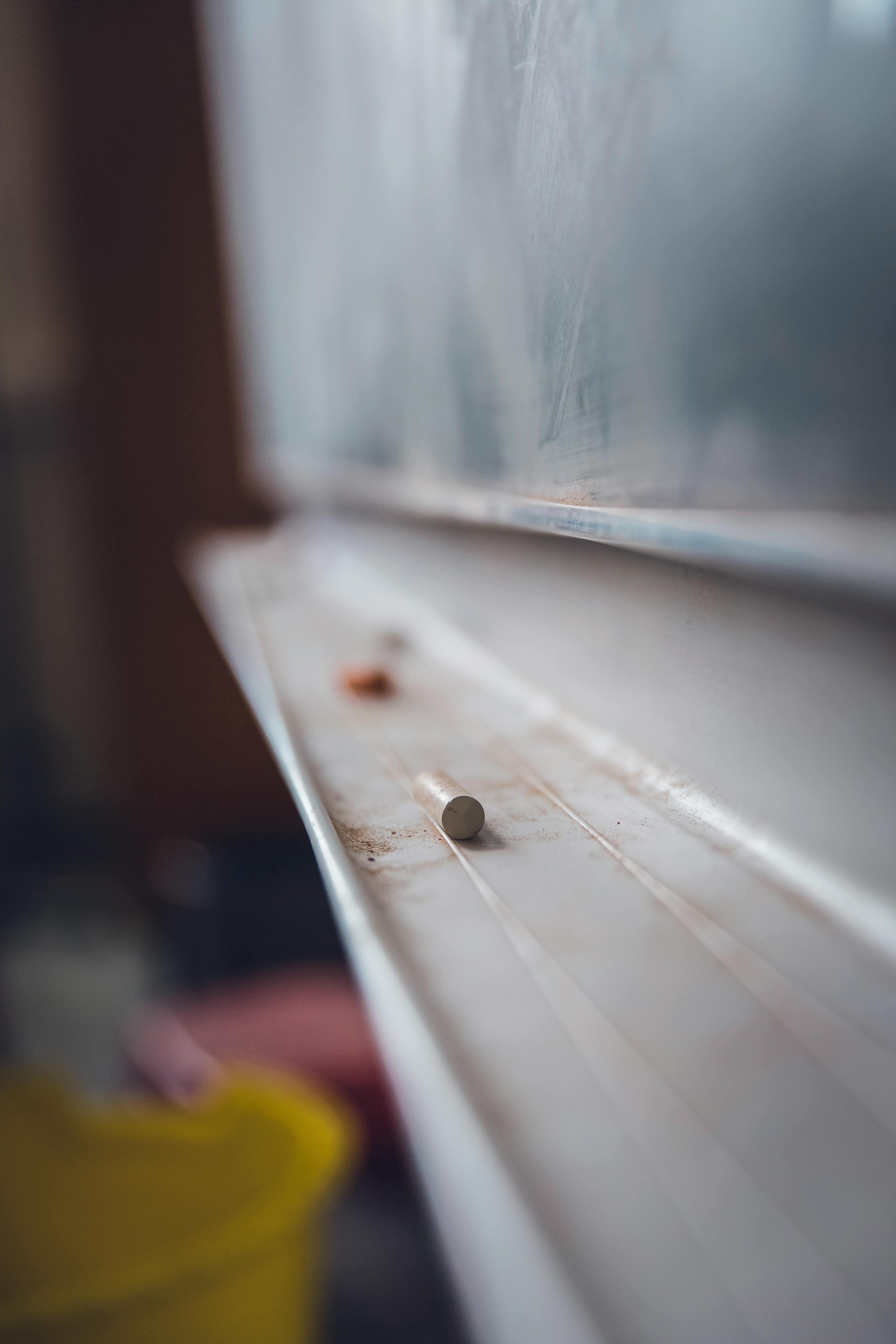 A close up of a piece of chalk on a chalkboard | Source: Pexels