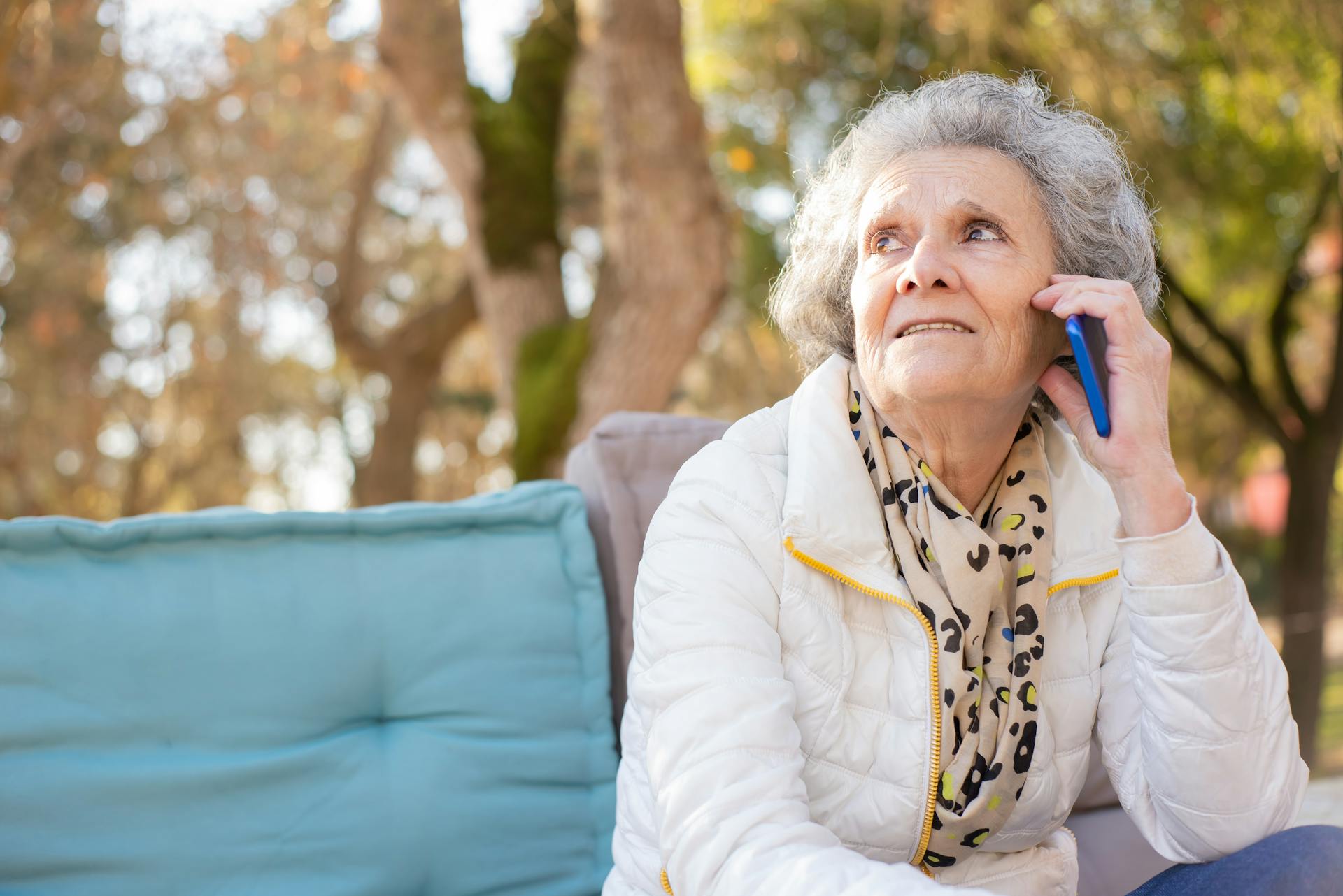 An elderly woman talking on the phone | Source: Pexels
