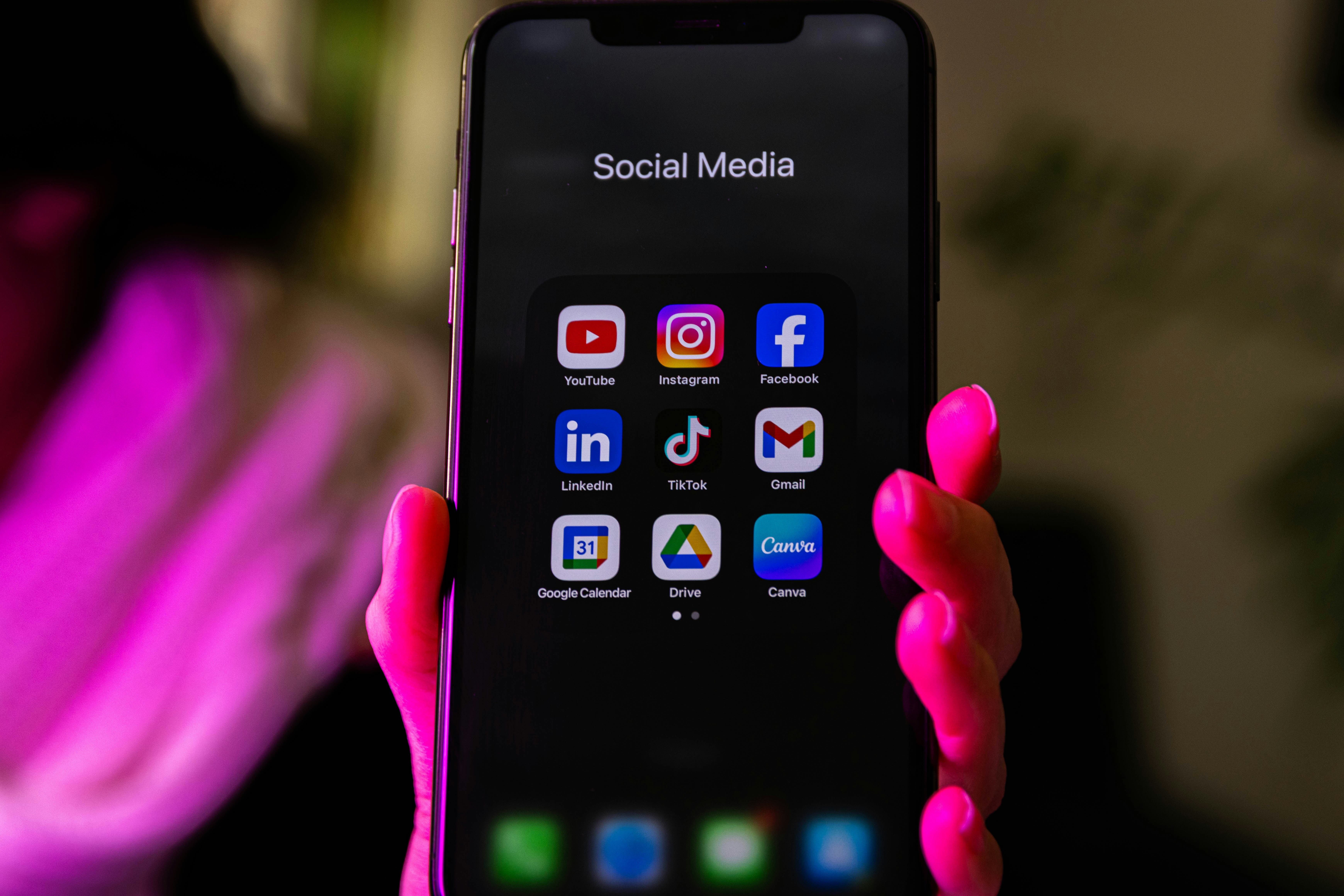 A person holding a cellphone to social media | Source: Unsplash