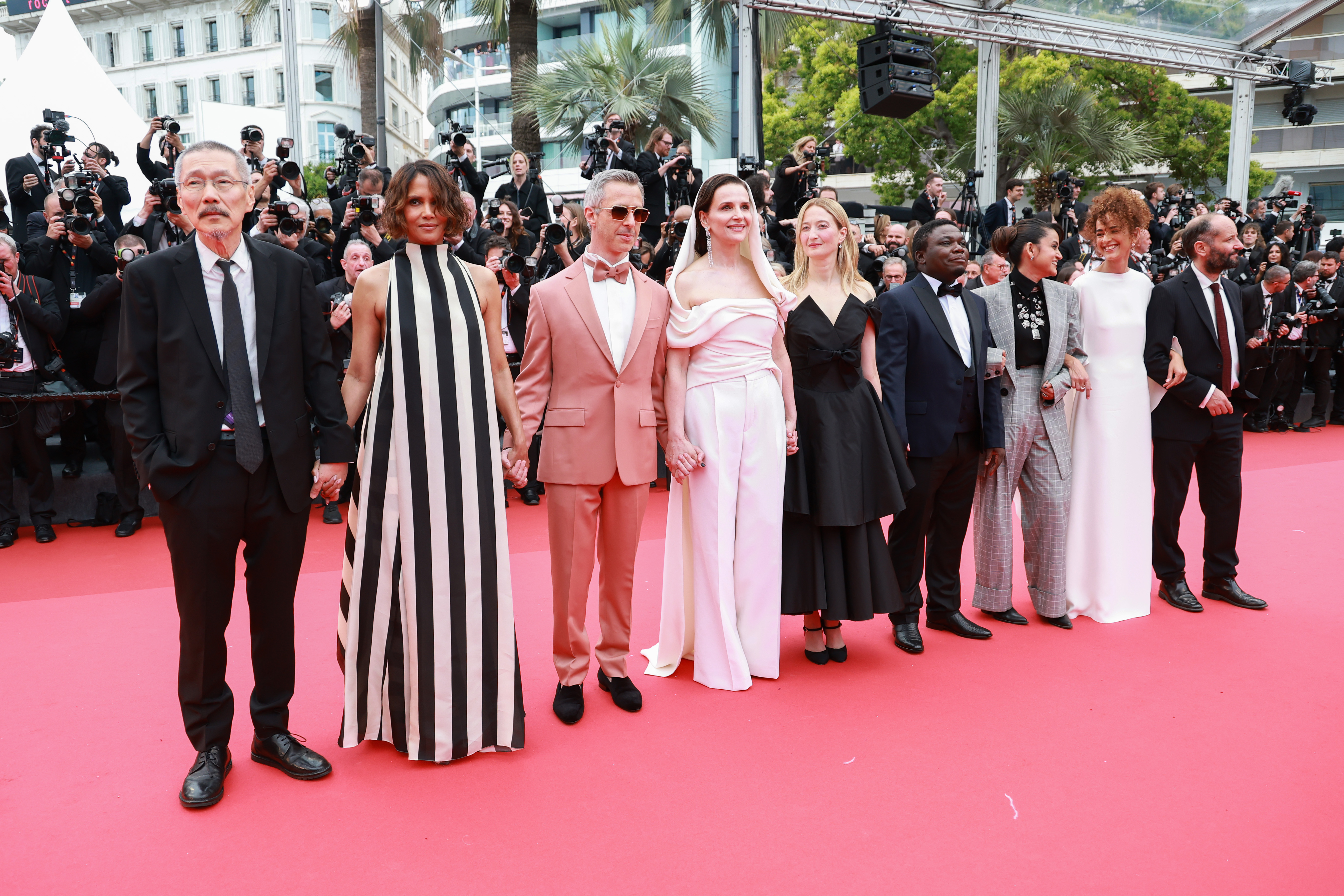 Jury Member Hong Sang-soo, Halle Berry, Jeremy Strong, Jury President Juliette Binoche, Alba Rohrwacher, Dieudo Hamadi, Payal Kapadia, Leïla Slimani and Carlos Reygadas attend the red carpet for the opening ceremony of the 78th annual Cannes Film Festival on May 13, 2025 | Source: Getty Images