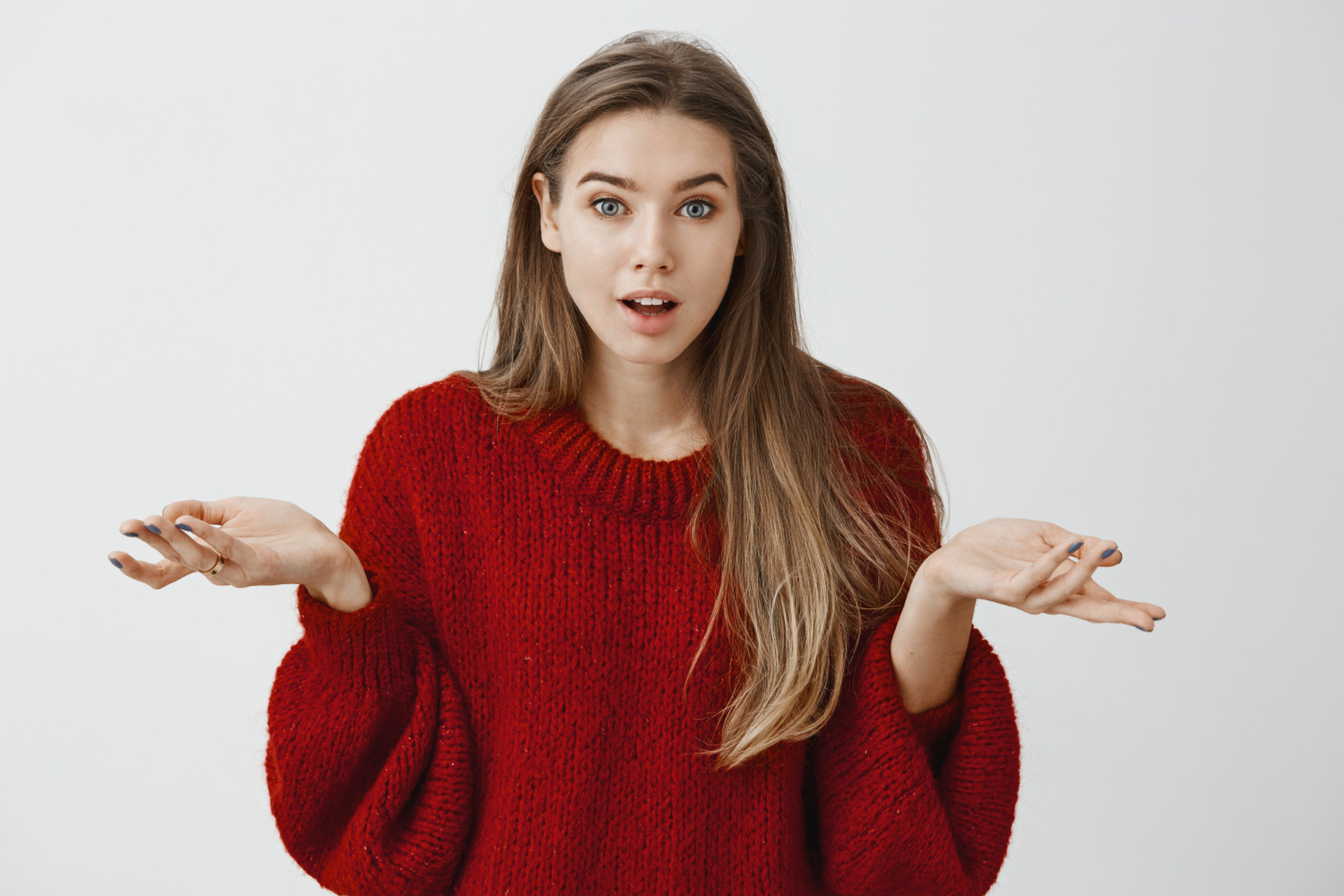 A woman shrugging | Source: Freepik