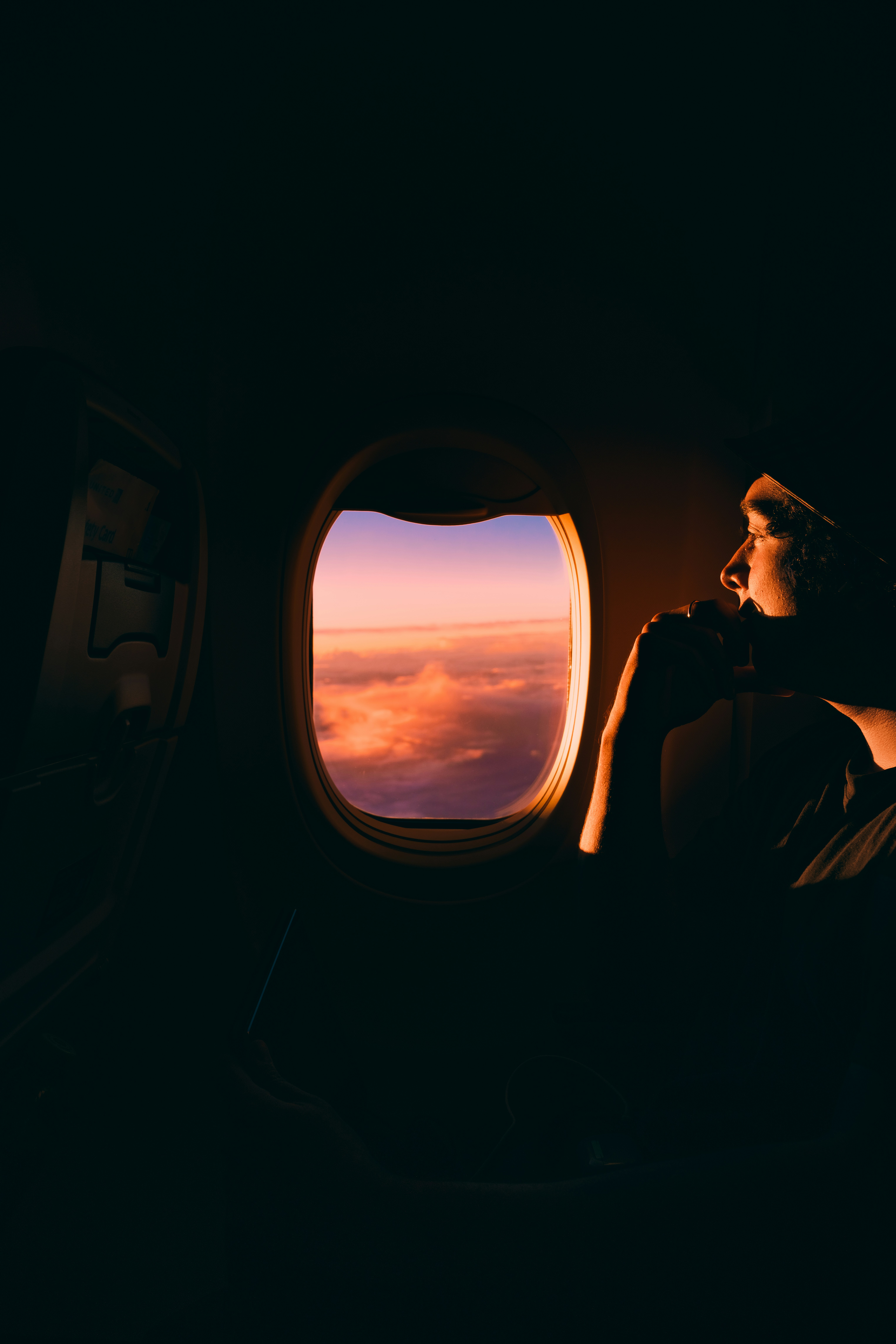 A man sitting in an airplane | Source: Unsplash
