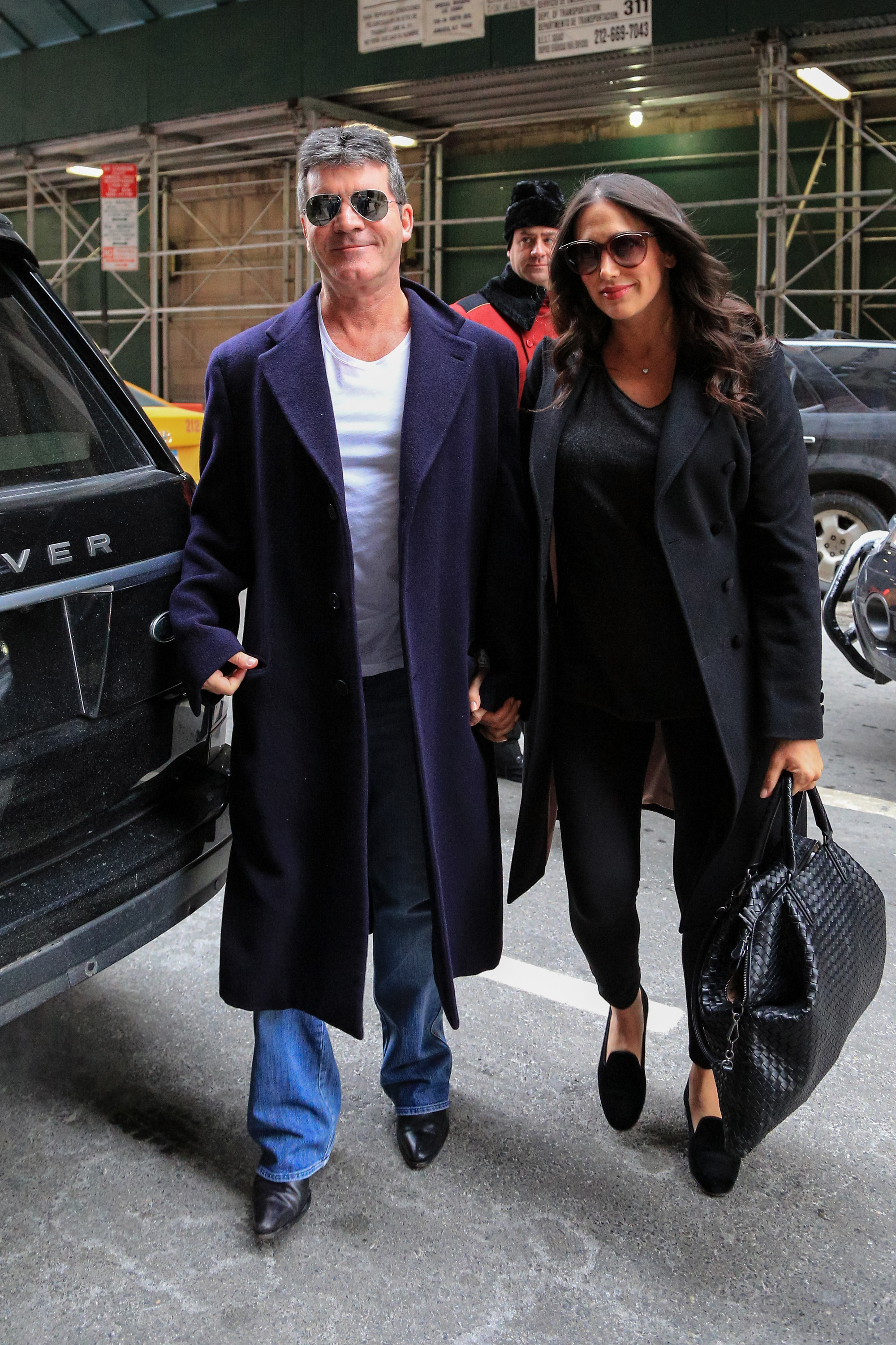 Simon Cowell with his partner Lauren Silverman are seen arriving at their hotel on February 16, 2014 in New York City. | Source: Getty Images