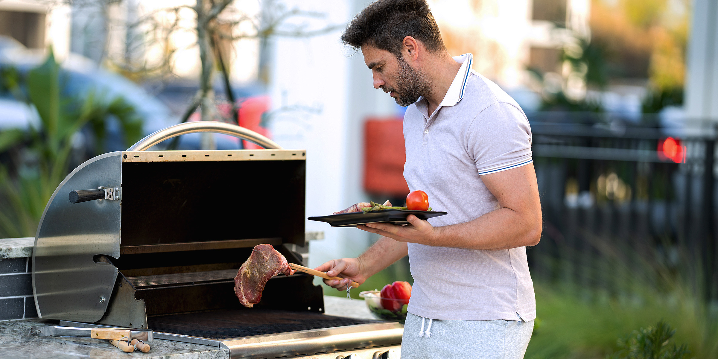 A man making a barbecue | Source: Shutterstock