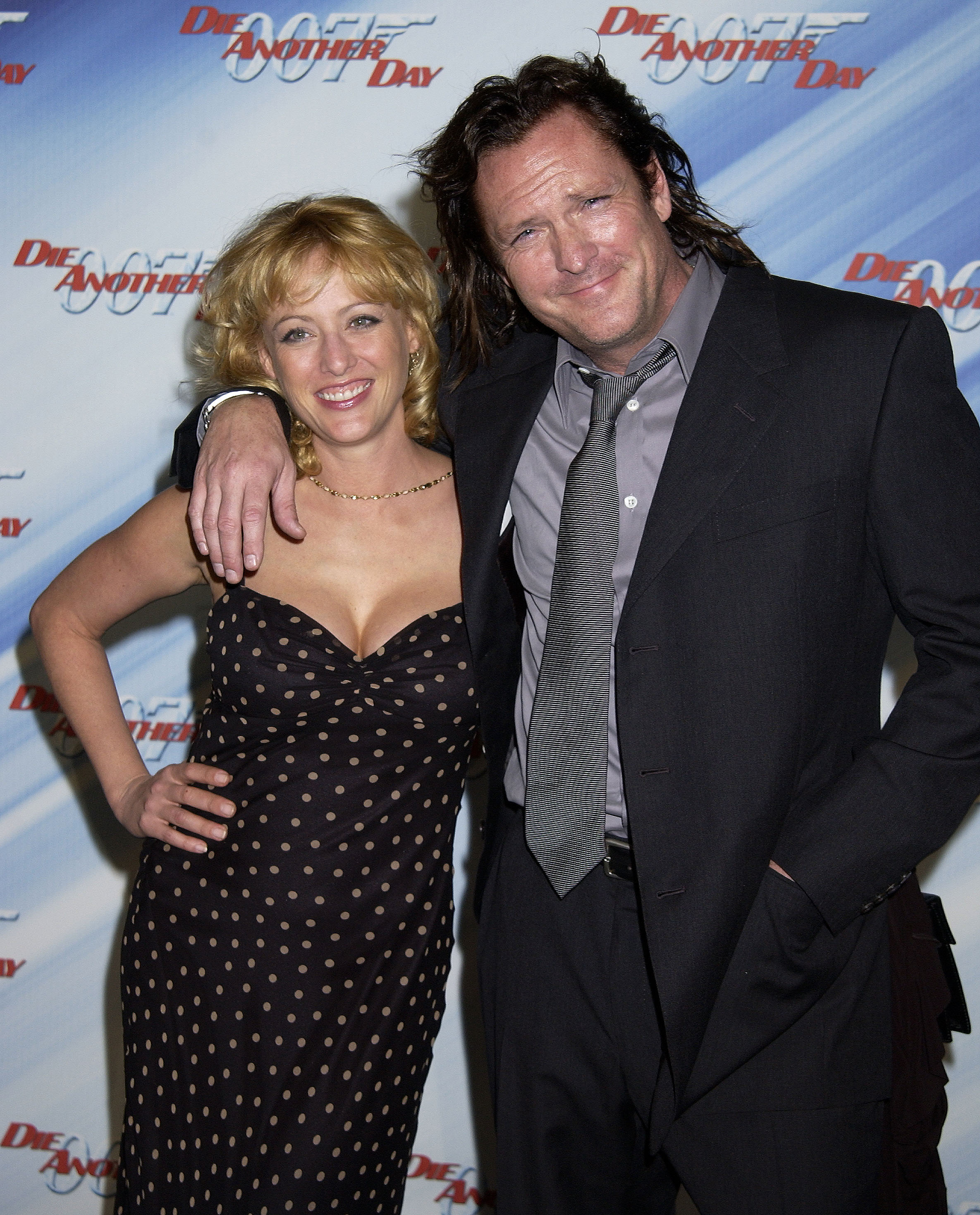 Virginia Madsen & Michael Madsen pose during the "Die Another Day" Los Angeles Premiere at Shrine Auditorium on November 11, 2002, in Los Angeles, California. | Source: Getty Images