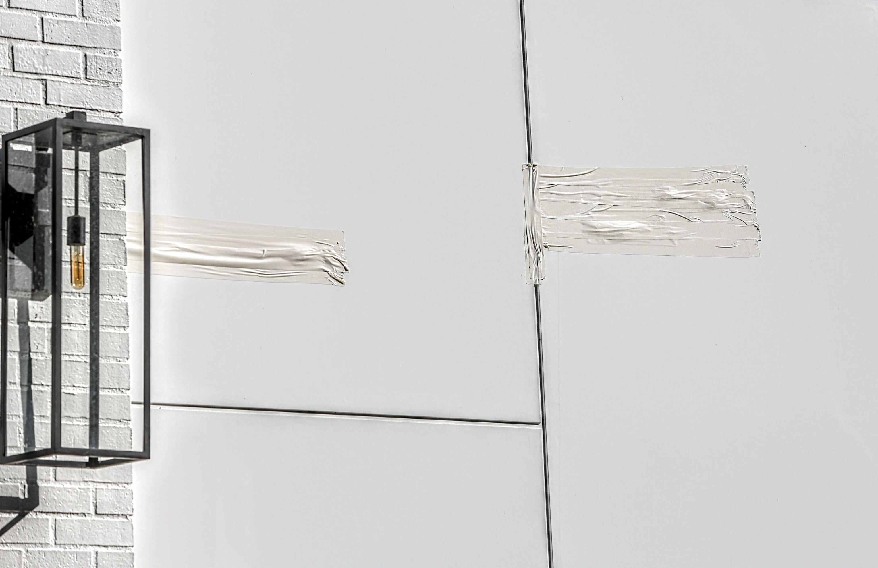 Tape covers an area allegedly struck by bullets at the entrance to Rihanna's home on March 09, 2026 in Beverly Hills, California. | Source: Getty Images