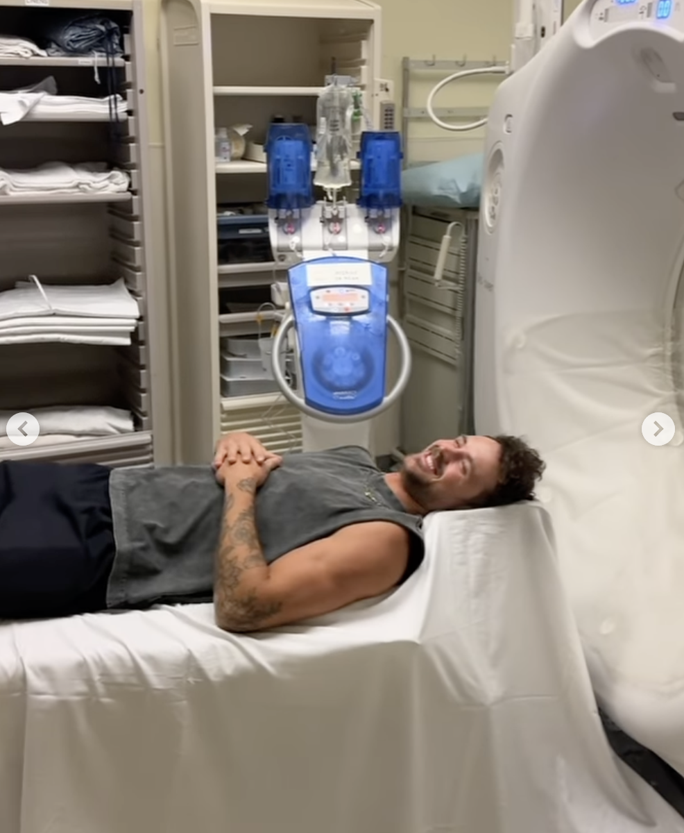 Dylan Efron laughing in front of an MRI machine, posted on October 26, 2025. | Source: Instagram/dylanefron