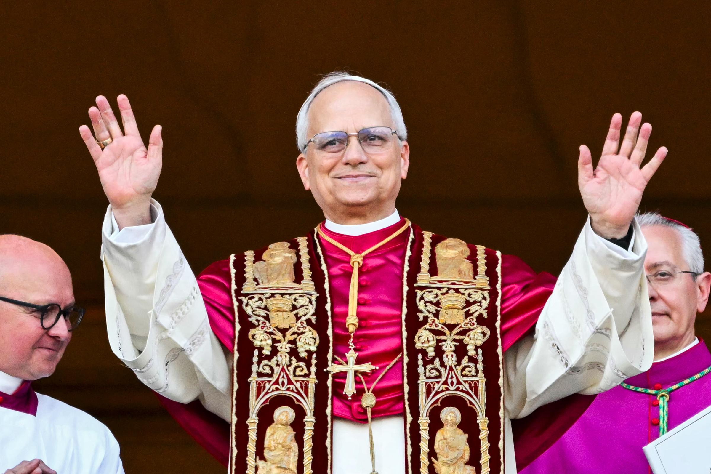 Newly elected Pope Leo XIV, Robert Prevost arrives on the main central loggia balcony of the St Peter's Basilica for the first time after the cardinals ended the conclave on May 8, 2025, in The Vatican. | Source: Getty Images