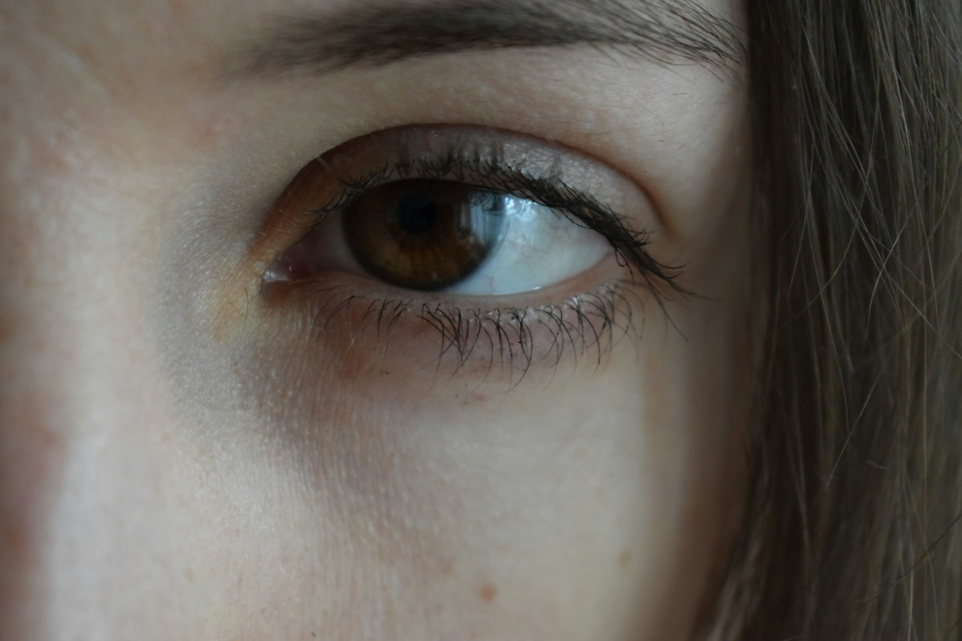 Close-up shot of a woman staring | Source: Unsplash