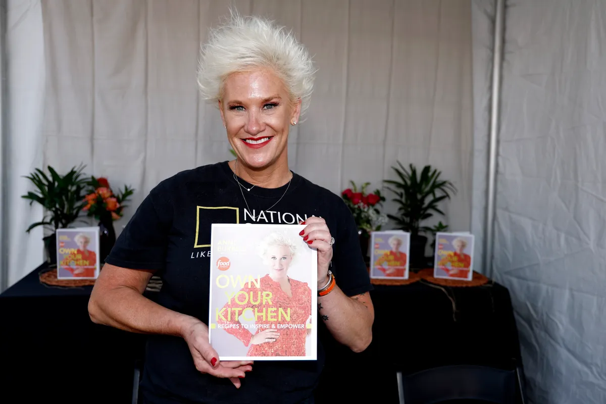 Anne Burrell poses during a book signing at the Food Network New York City Wine & Food Festival presented by Capital One - Grand Tasting featuring Culinary Demonstrations presented by Liebherr Appliances on October 15, 2022, in New York City. | Source: Getty Images