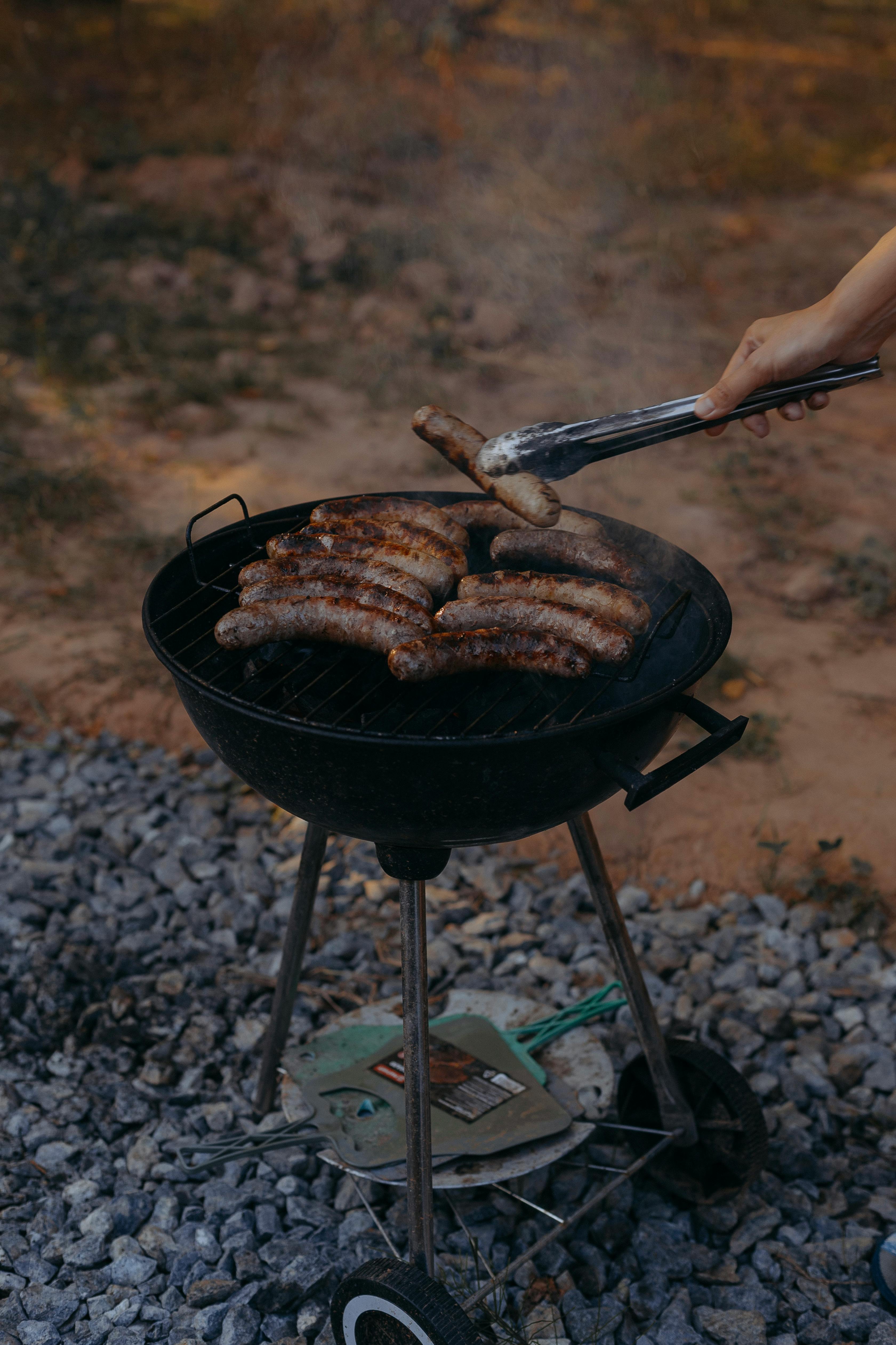 Someone grilling sausages | Source: Pexels