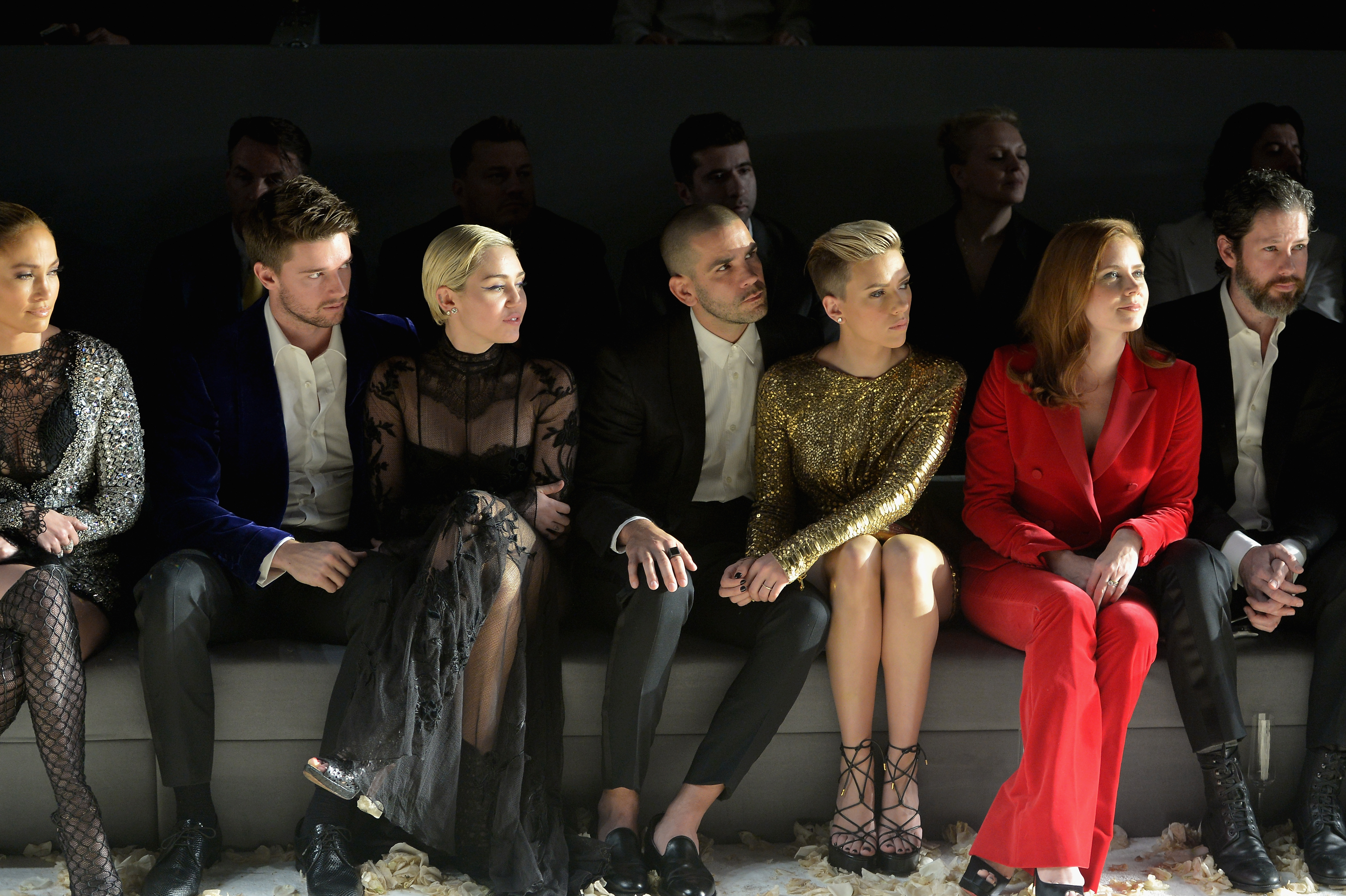 Jennifer Lopez, Patrick Schwarzenegger, Miley Cyrus, Romain Dauriac, Scarlett Johansson, Amy Adams, and Darren Le Gallo attend the TOM FORD Autumn/Winter 2015 Womenswear Collection Presentation at Milk Studios in Los Angeles on February 20, 2015. | Source: Getty Images