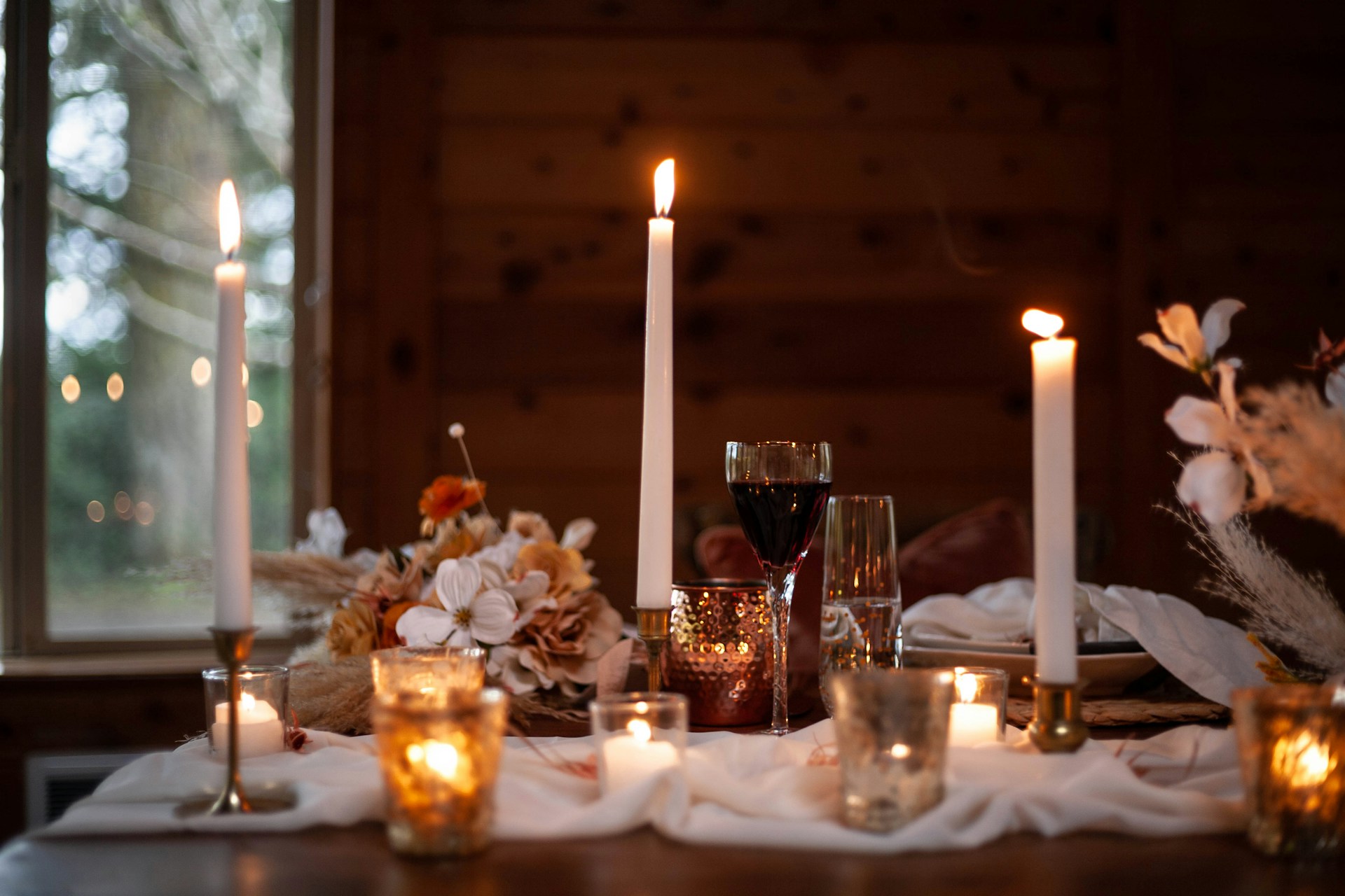 A table set with drinks and candles | Source: Unsplash