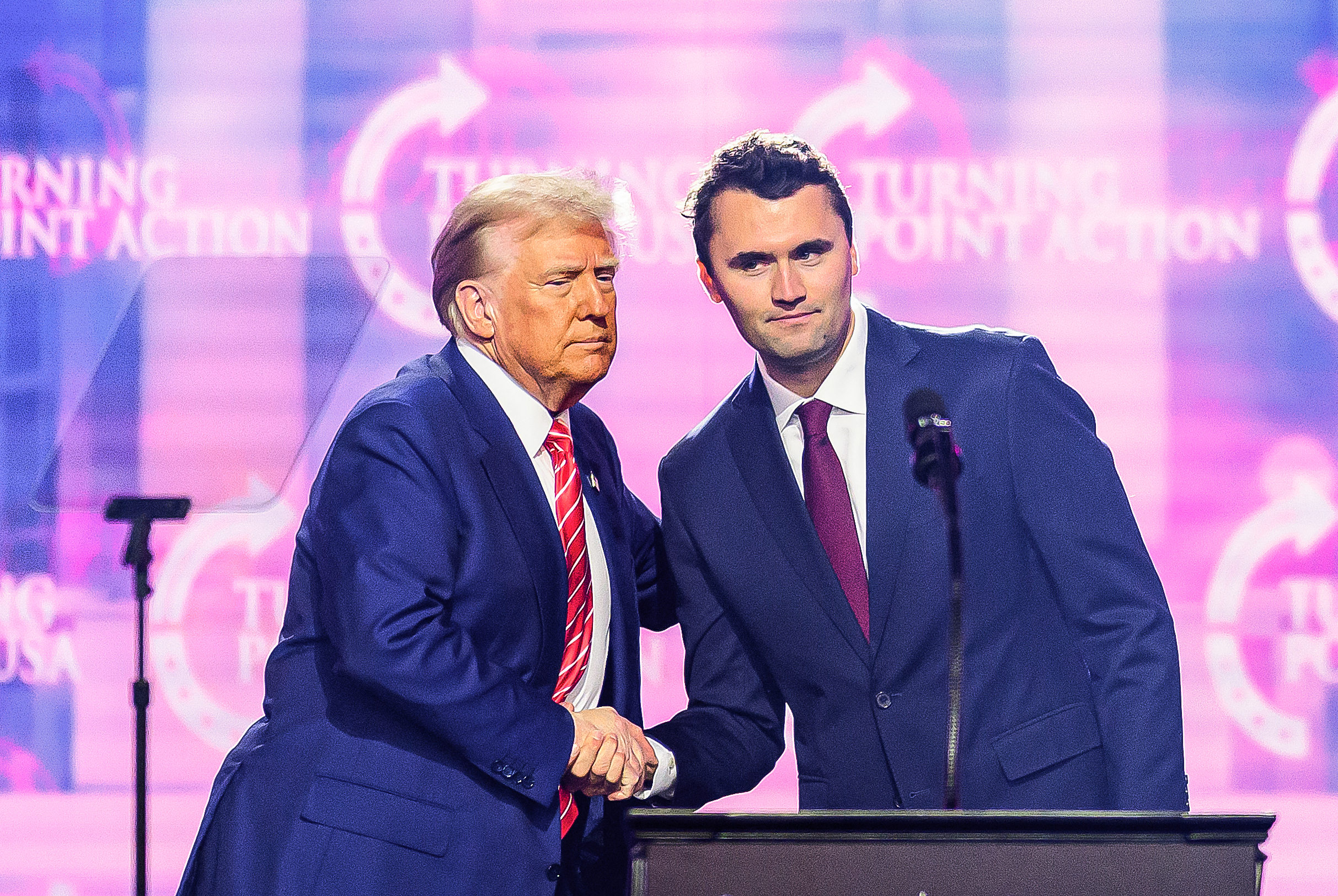 Charlie Kirk speaks on stage with President Donald Trump at America Fest 2024 on December 22, 2024, in Phoenix, Arizona. | Source: Getty Images