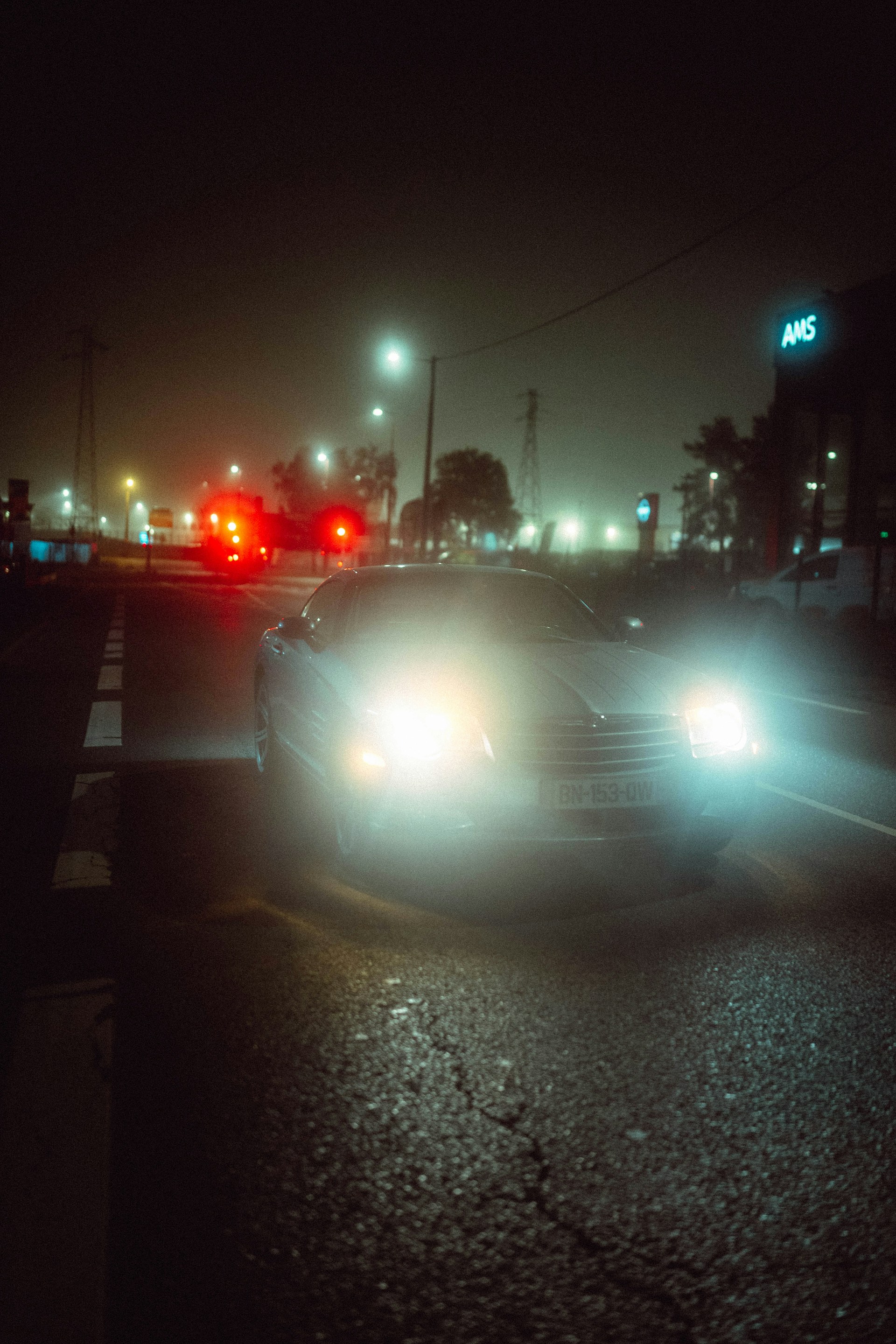 A car on a foggy road | Source: Unsplash