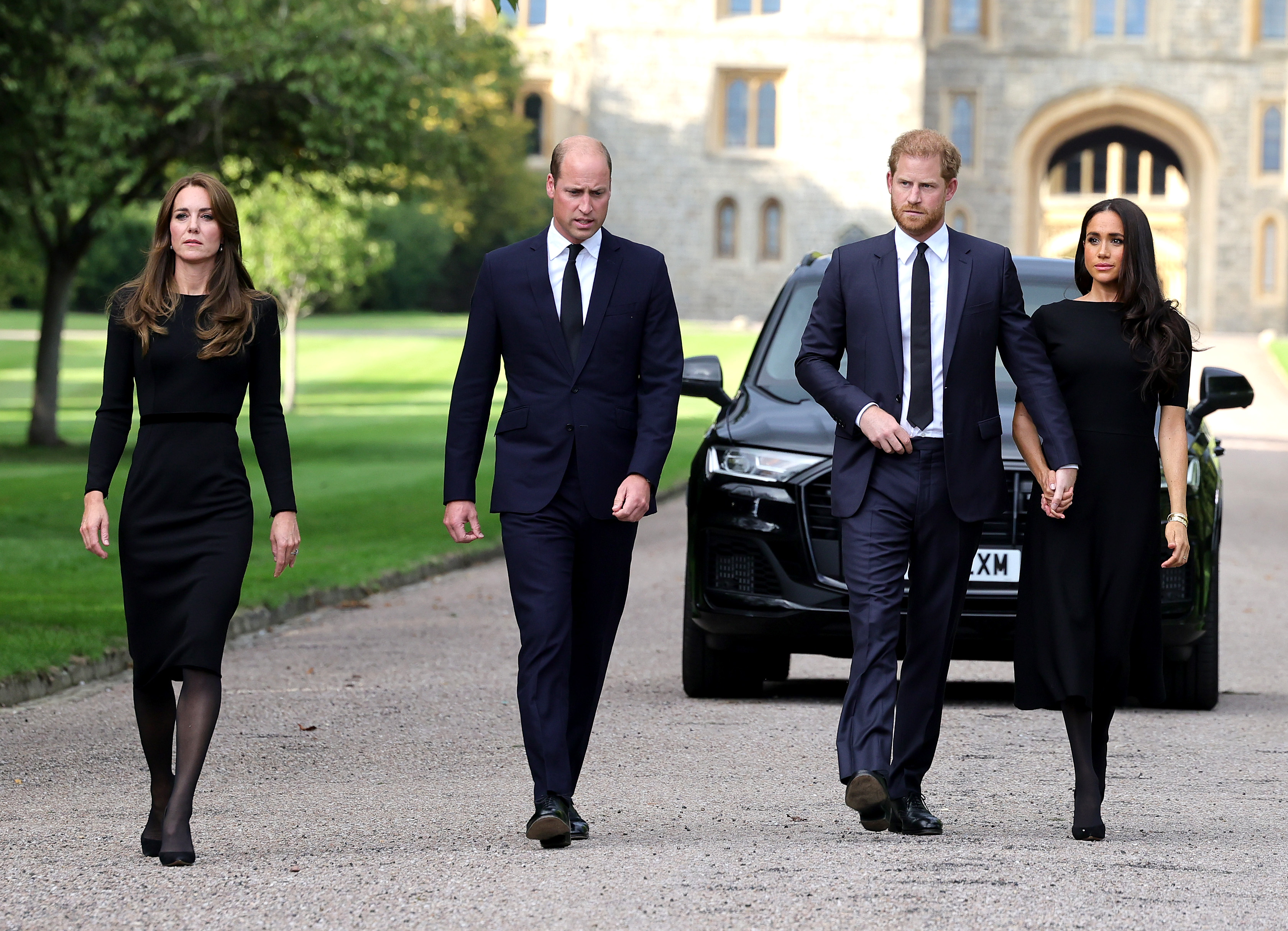Catherine, Princess of Wales, Prince William, Prince of Wales, Prince Harry, Duke of Sussex, and Meghan, Duchess of Sussex on the long Walk at Windsor Castle arrive to view flowers and tributes to HM Queen Elizabeth on September 10, 2022 in Windsor, England. | Source: Getty Images
