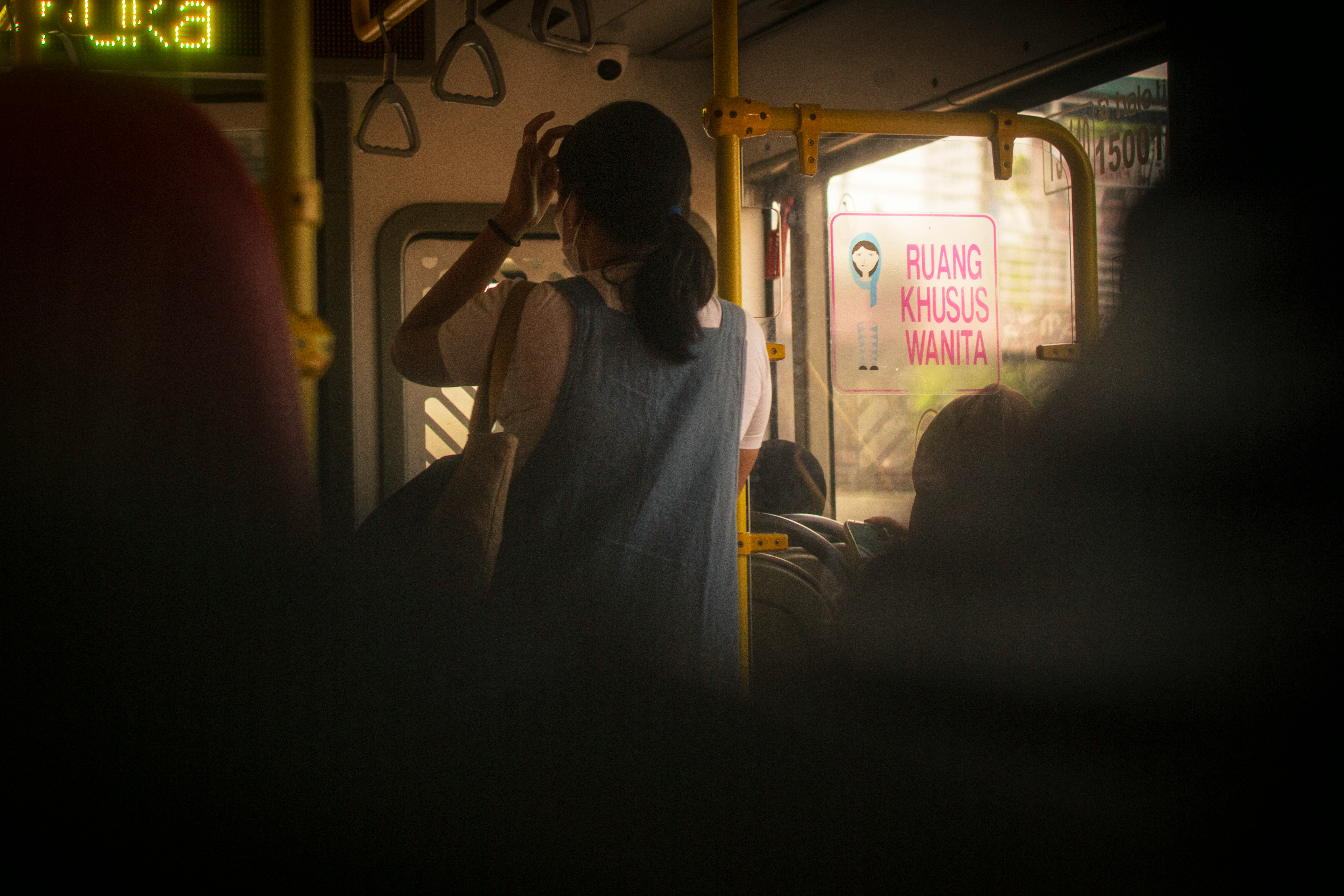A woman standing in a bus | Source: Unsplash