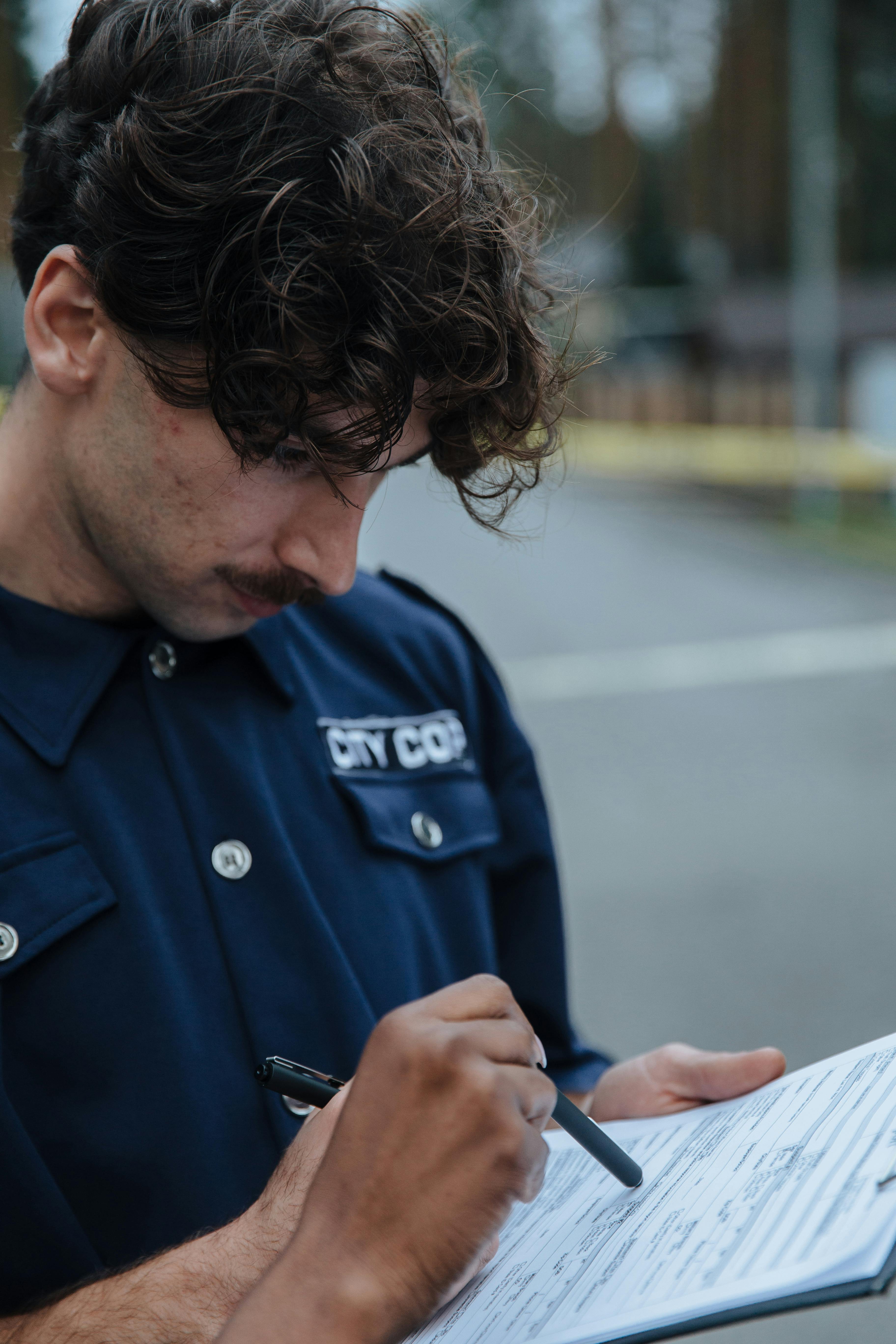 A police officer looking at a document | Source: Pexels