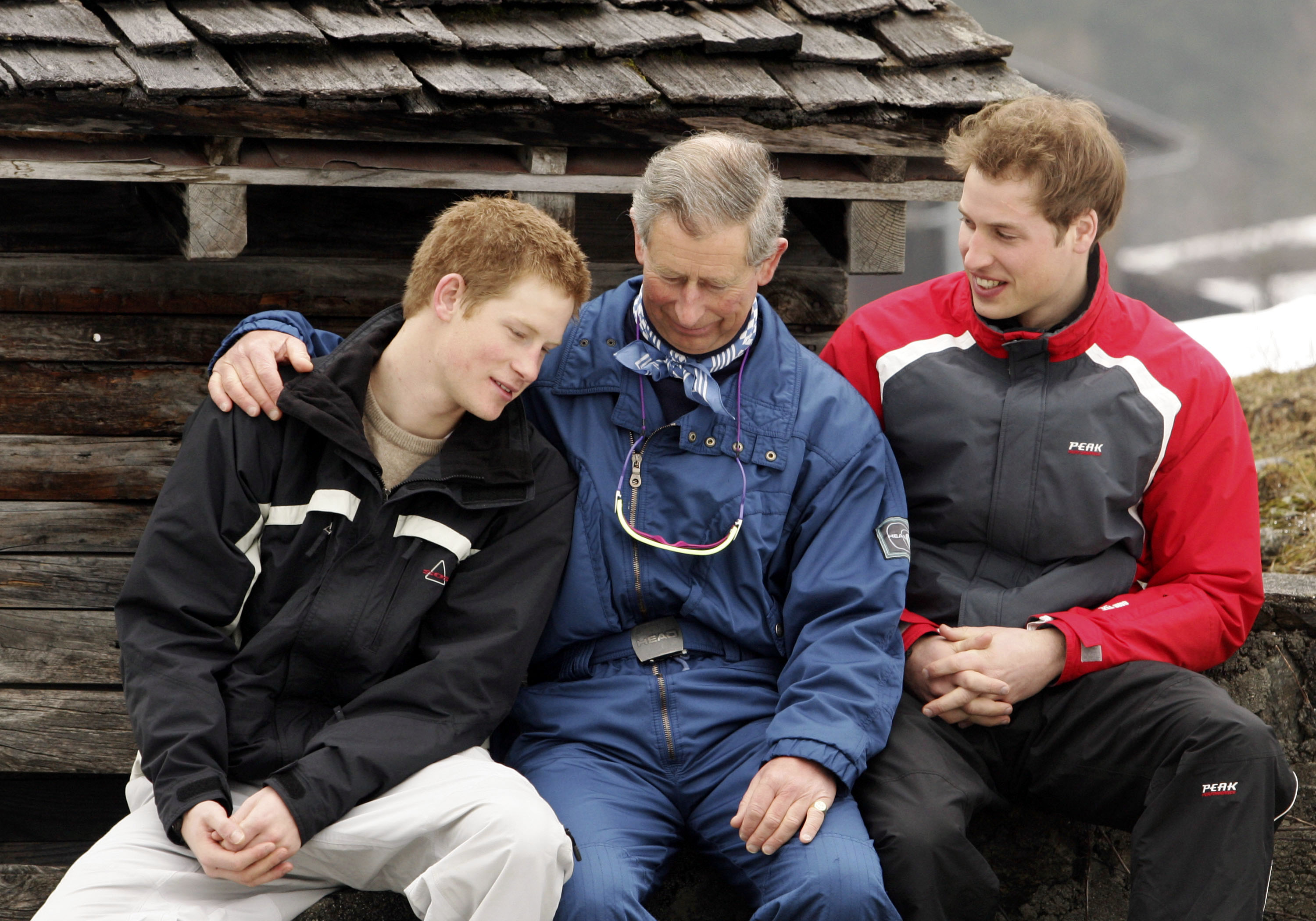 King Charles III poses with his sons Prince William (R) and Prince Harry (L) during the Royal Family's ski break at Klosters on March 31, 2005 in Switzerland. | Source: Getty Images