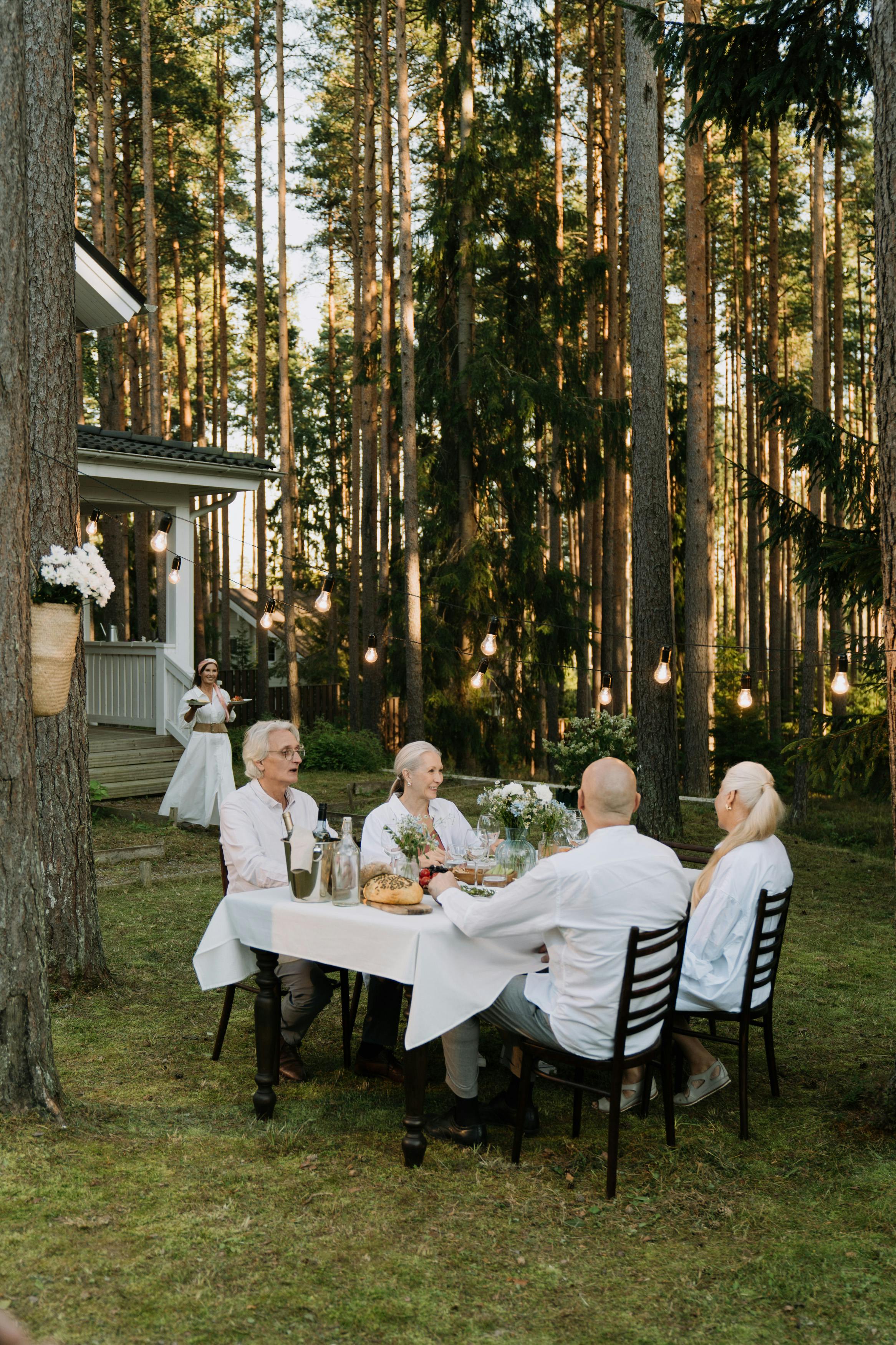 People sitting in a backyard | Source: Pexels