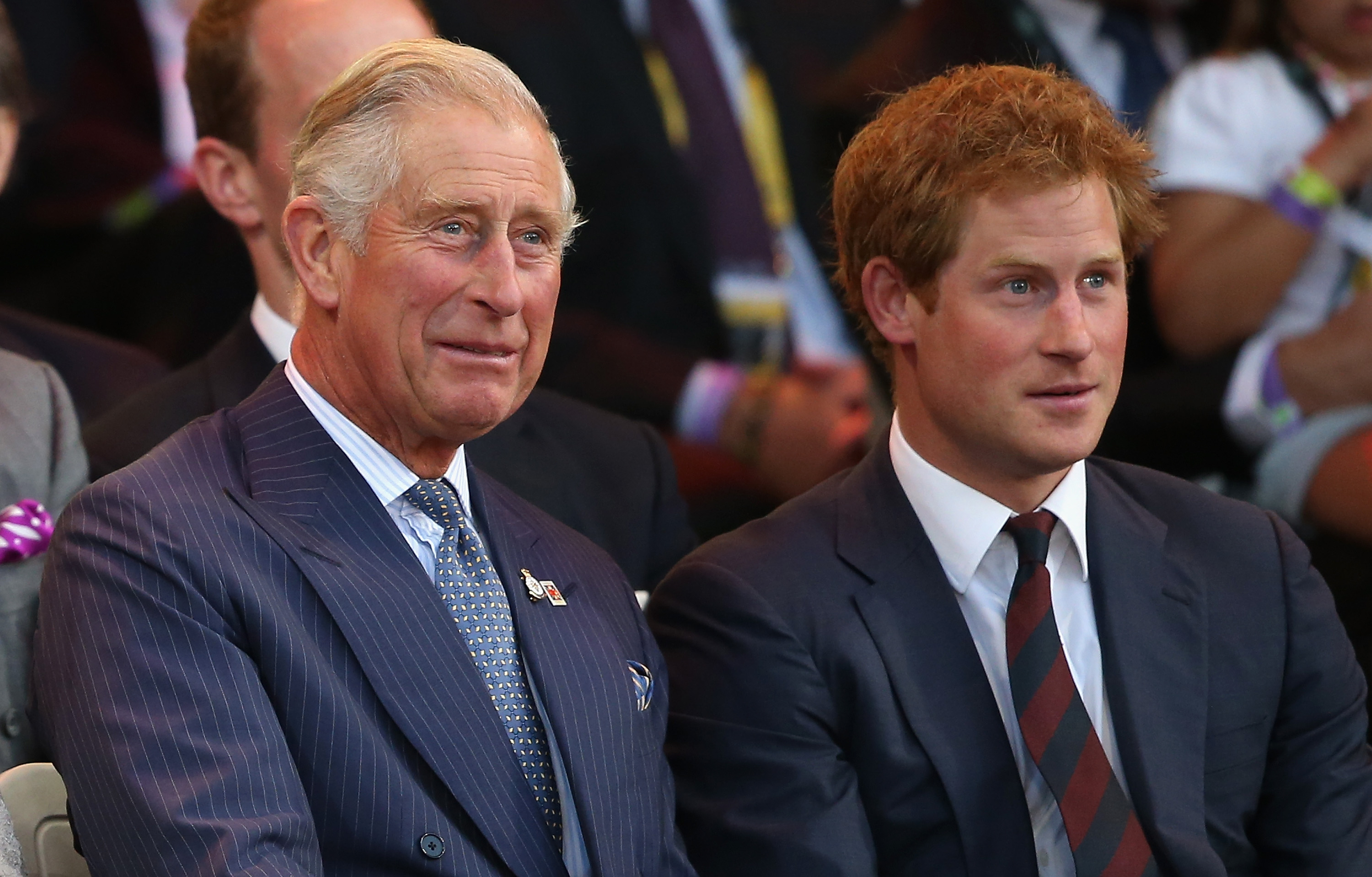 Prince Charles and Prince Harry laugh during the Invictus Games Opening Ceremony on September 10, 2014 in London, England | Source: Getty Images