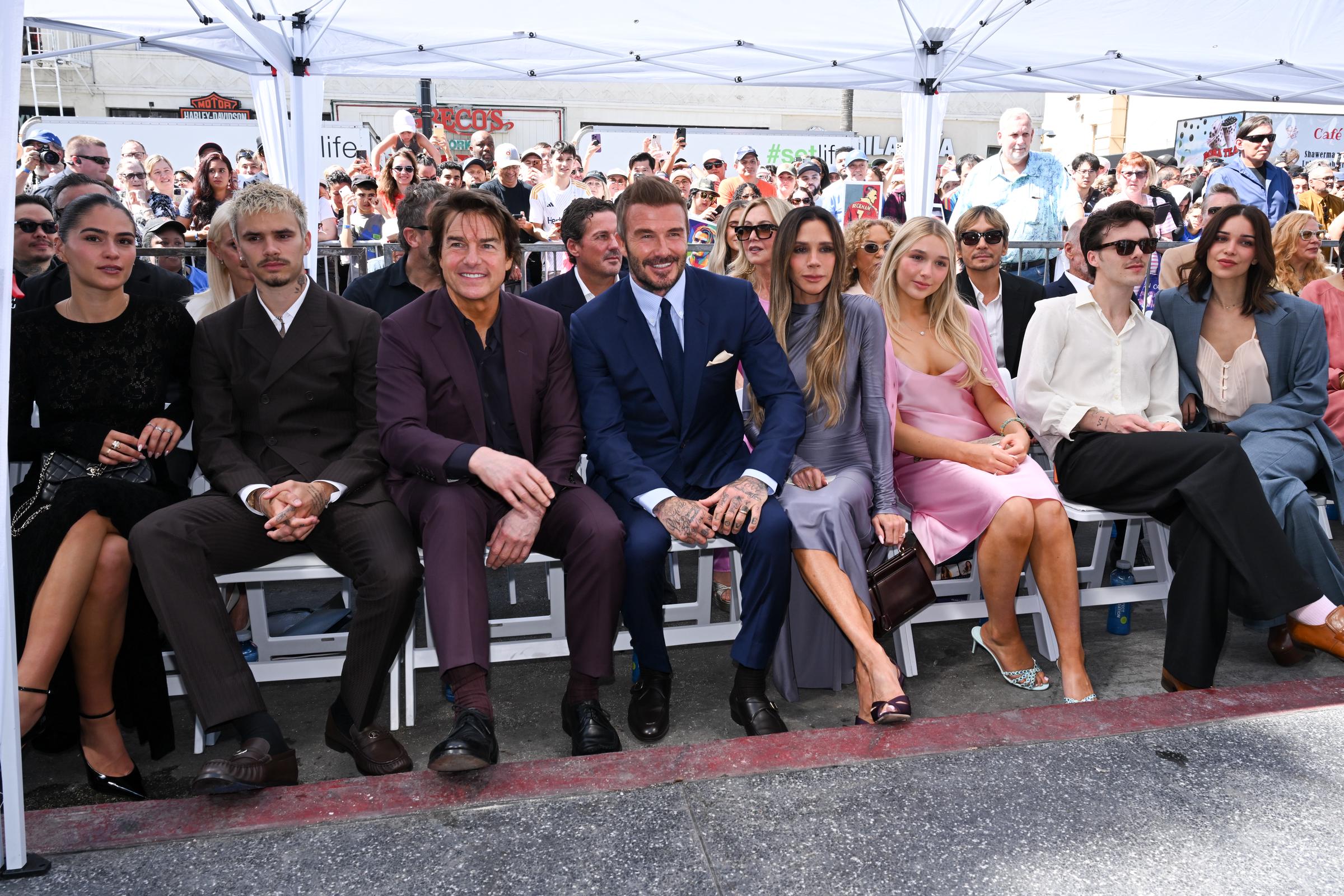 Kim Turnbull, Romeo Beckham, Tom Cruise, David Beckham, Victoria Beckham, Harper Beckham, Cruz Beckham and Jackie Apostel attend David's Hollywood Walk of Fame Star Ceremony on June 12, 2026 in Hollywood, California. | Source: Getty Images