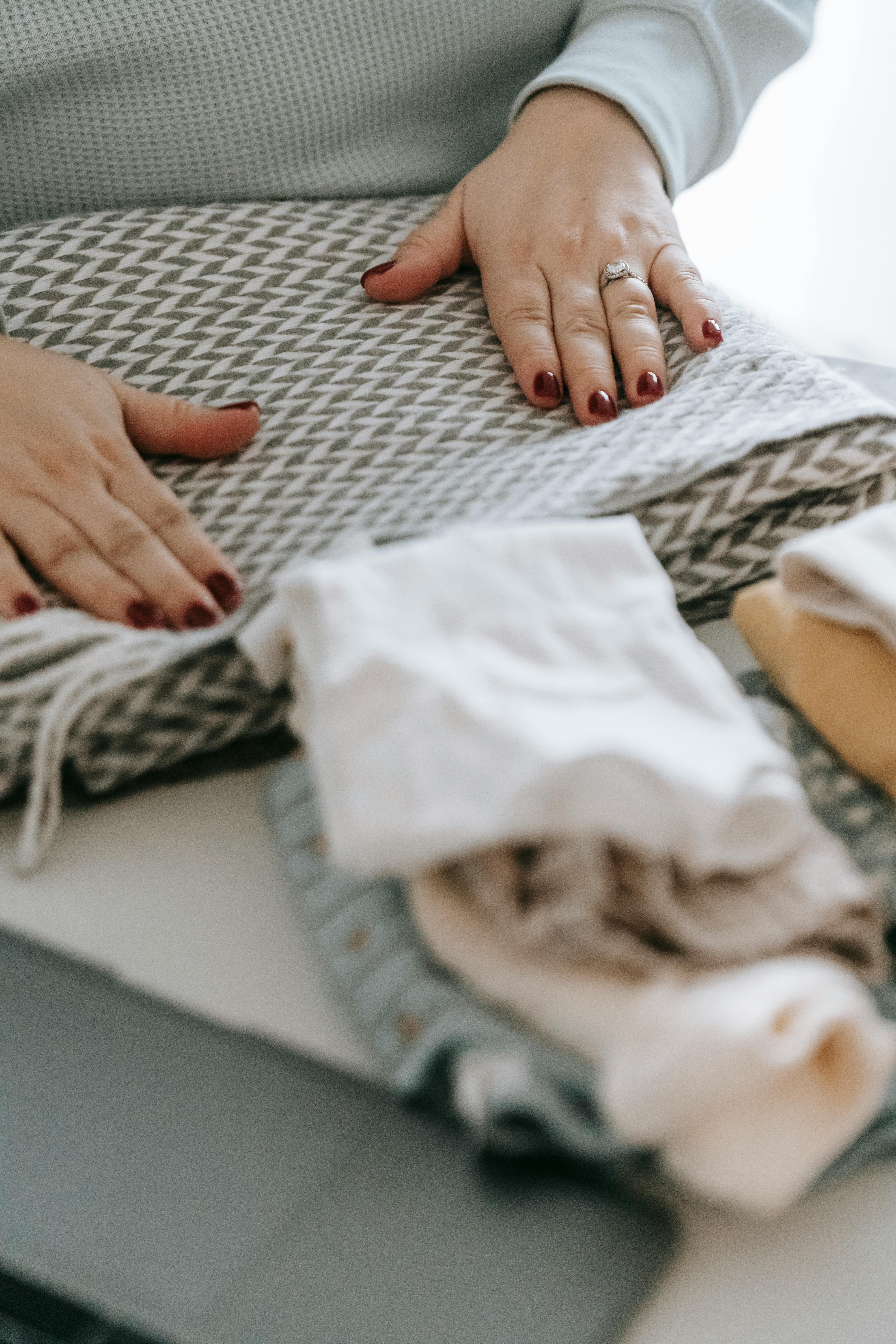 A woman folding laundry | Source: Pexels