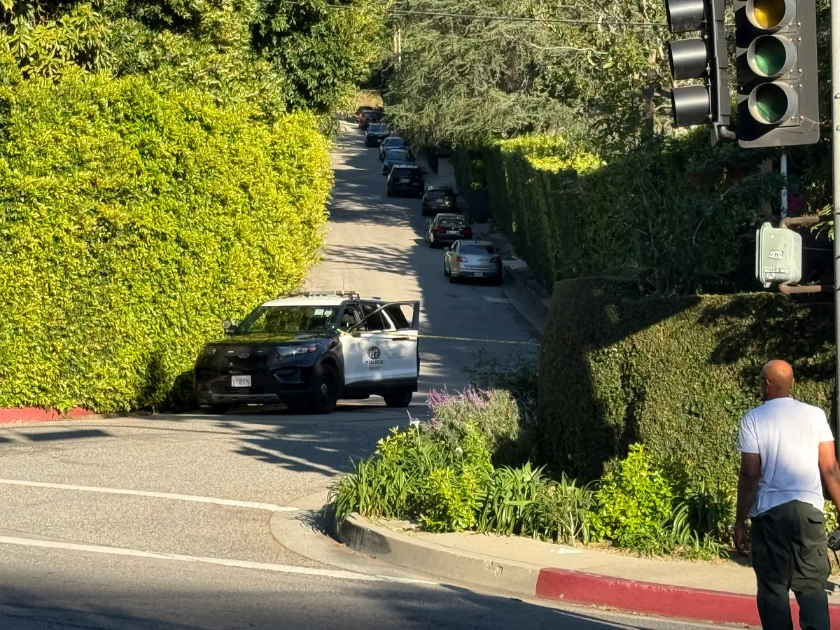 Police are seen outside Rihanna's home after a report of gunshots on March 08, 2026 in Beverly Hills, California. | Source: Getty Images