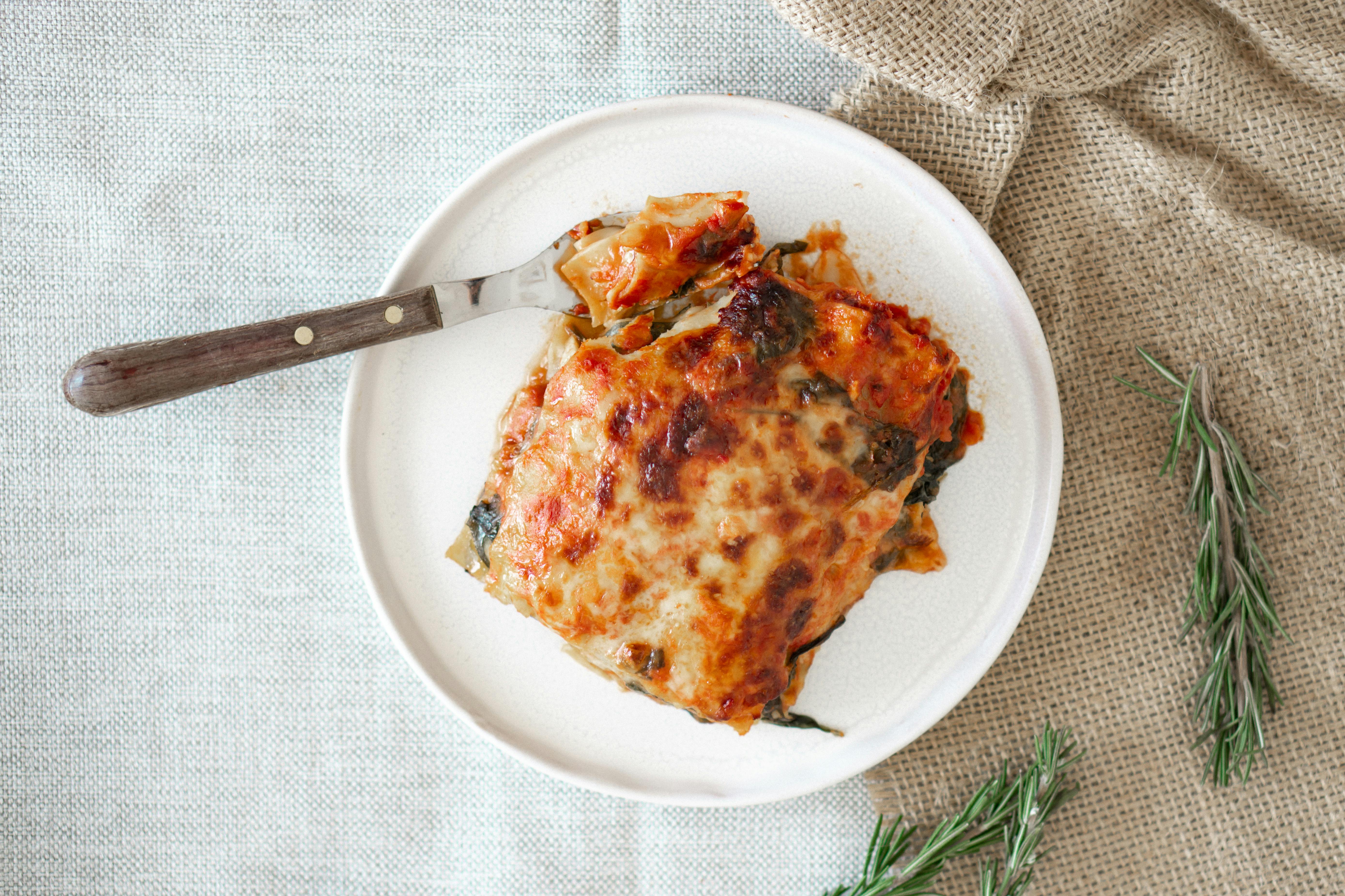 A slice of lasagna on a plate | Source: Pexels