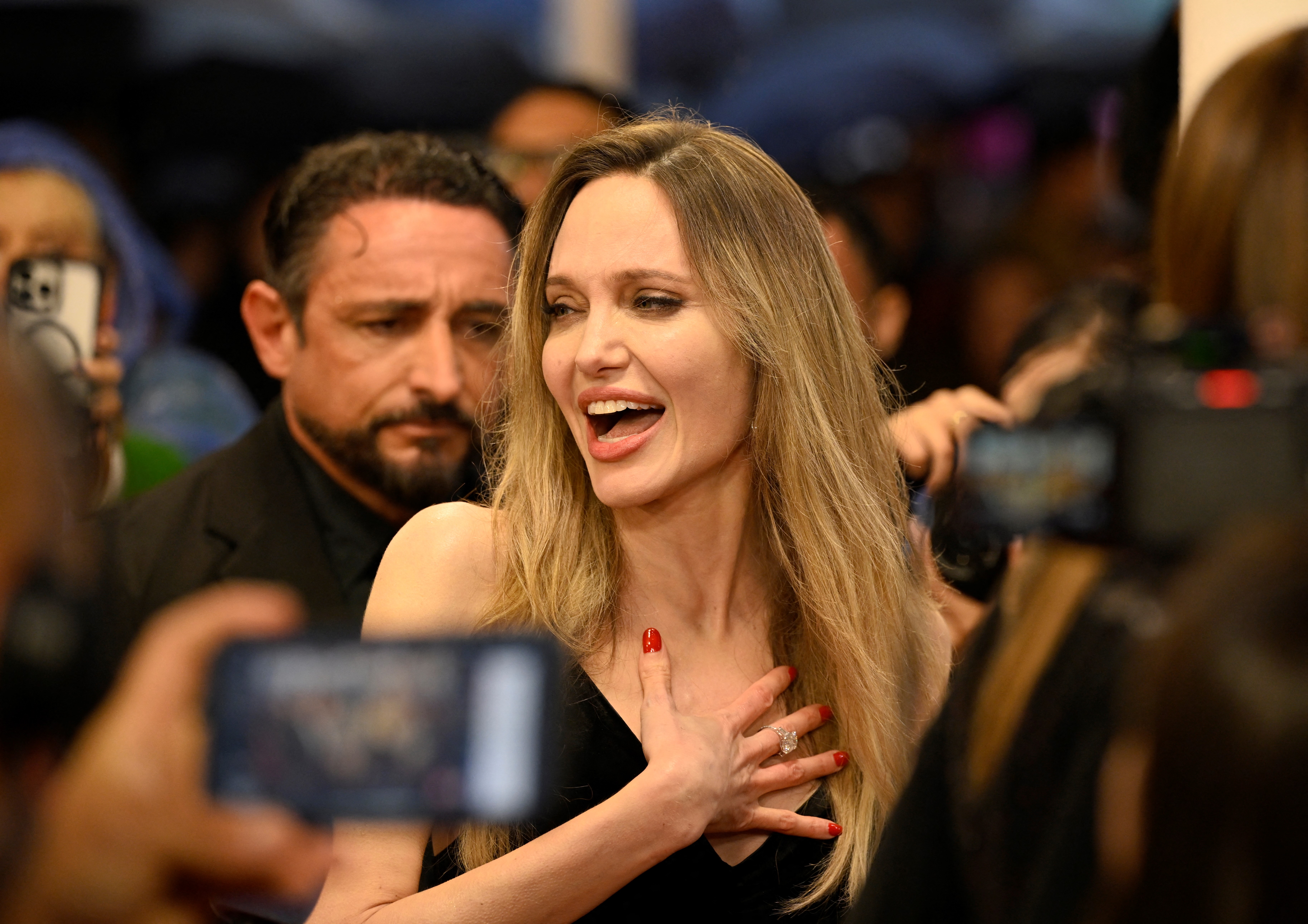 Angelina Jolie gestures during the photocall of the film "Couture" at the 73rd San Sebastian International Film Festival in the northern Spanish Basque city of San Sebastian on September 21, 2025. | Source: Getty Images