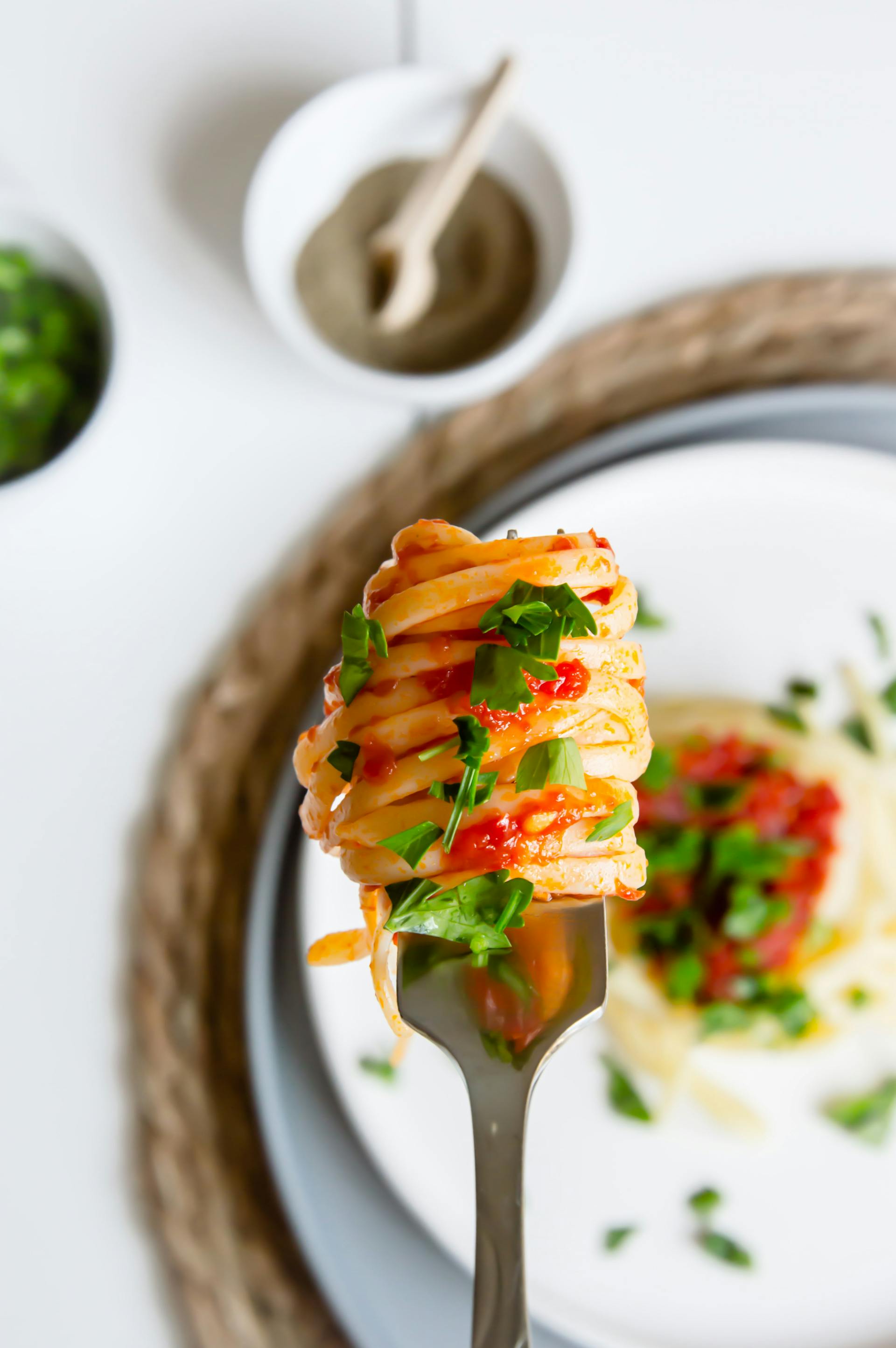 A fork with food midair | Source: Pexels