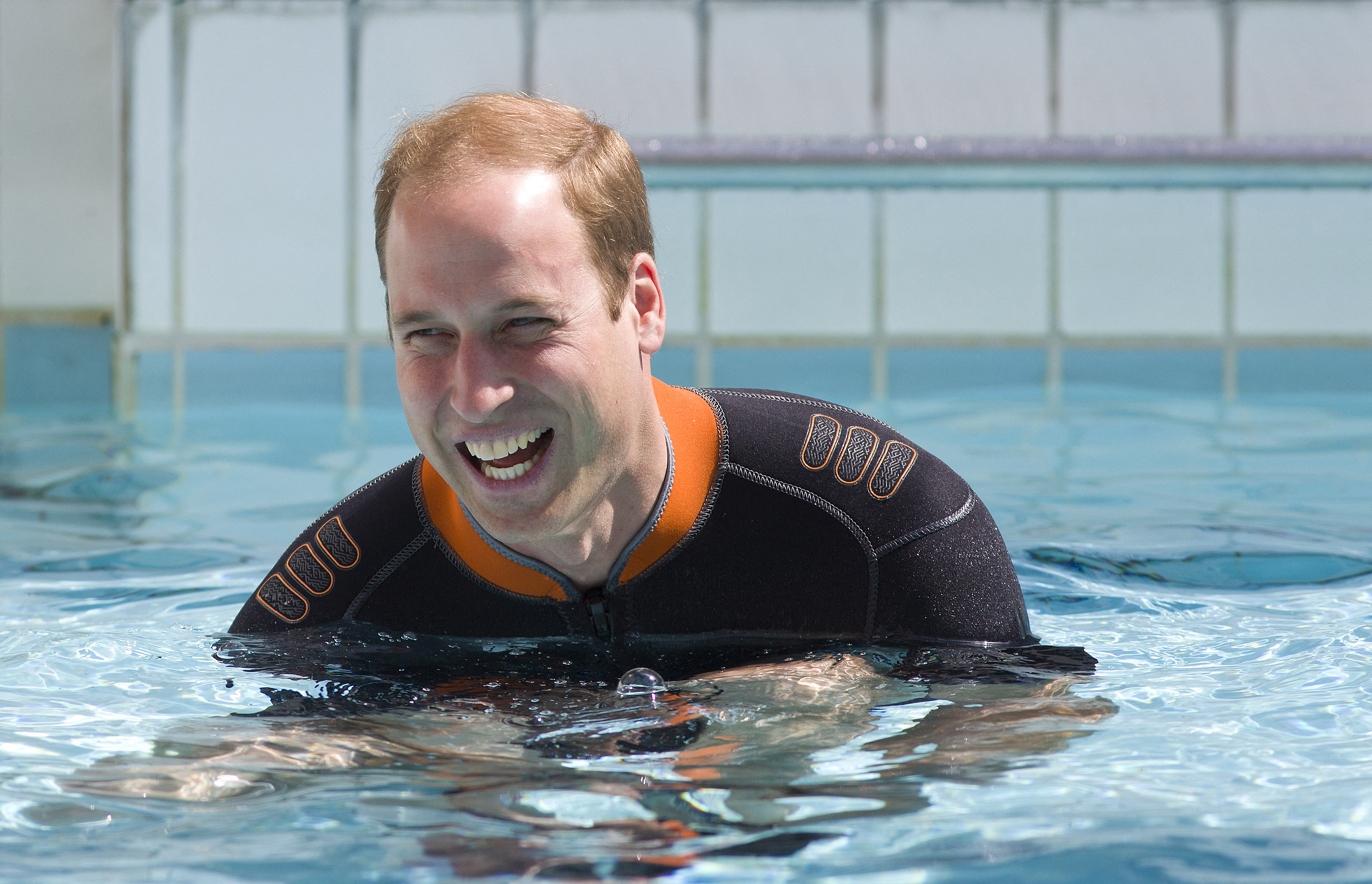 Prince William as he prepares to snorkel with British Sub-Aqua Club (BSAC) members at a swimming pool in central London on July 9, 2014 | Source: Getty Images