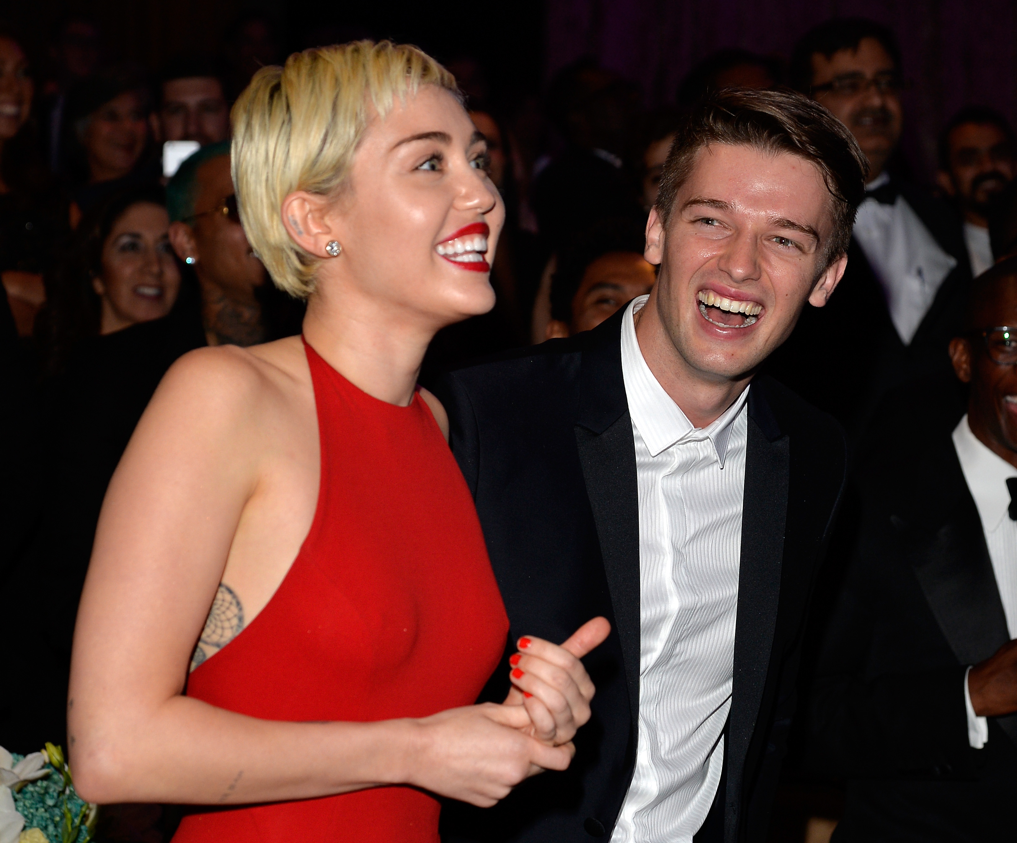 Miley Cyrus and Patrick Schwarzenegger attend the Pre-GRAMMY Gala and Salute to Industry Icons honoring Martin Bandier at The Beverly Hilton Hotel on February 7, 2015 in Los Angeles, California. | Source: Getty Images