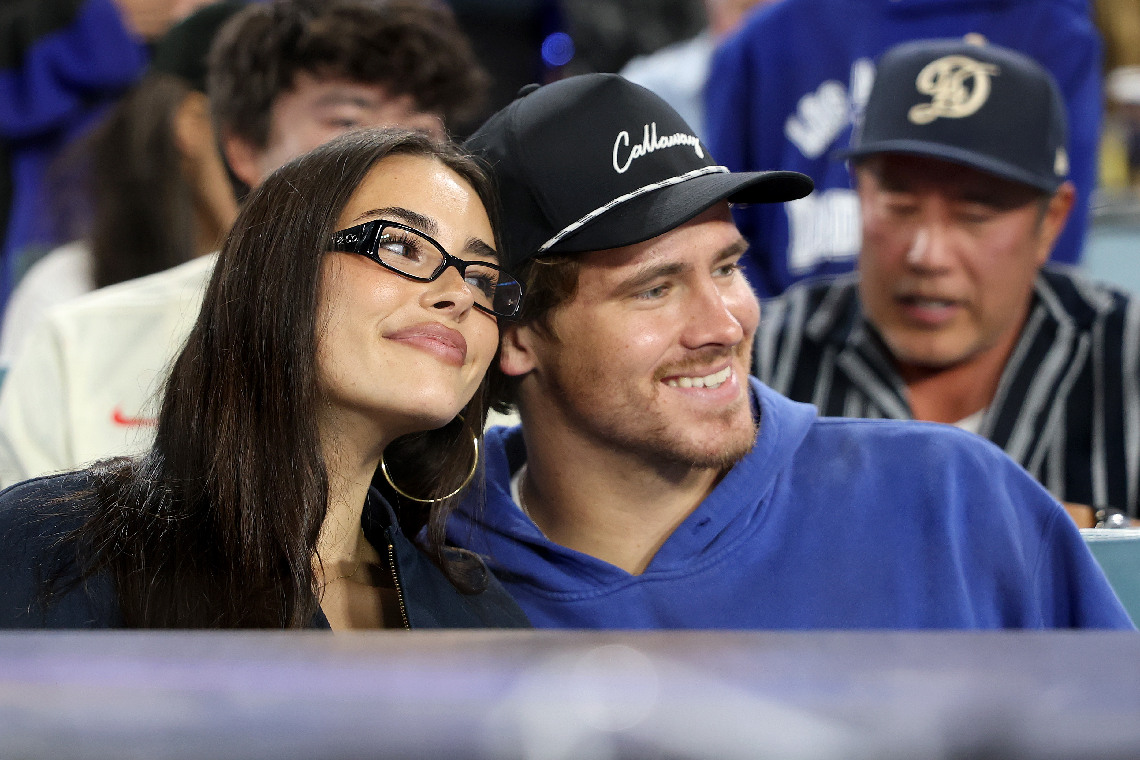 Madison Beer and Justin Herbert watching Game Three of the 2025 World Series between the Toronto Blue Jays and the Los Angeles Dodgers at Dodger Stadium on October 27 in Los Angeles, California. | Source: Getty Images