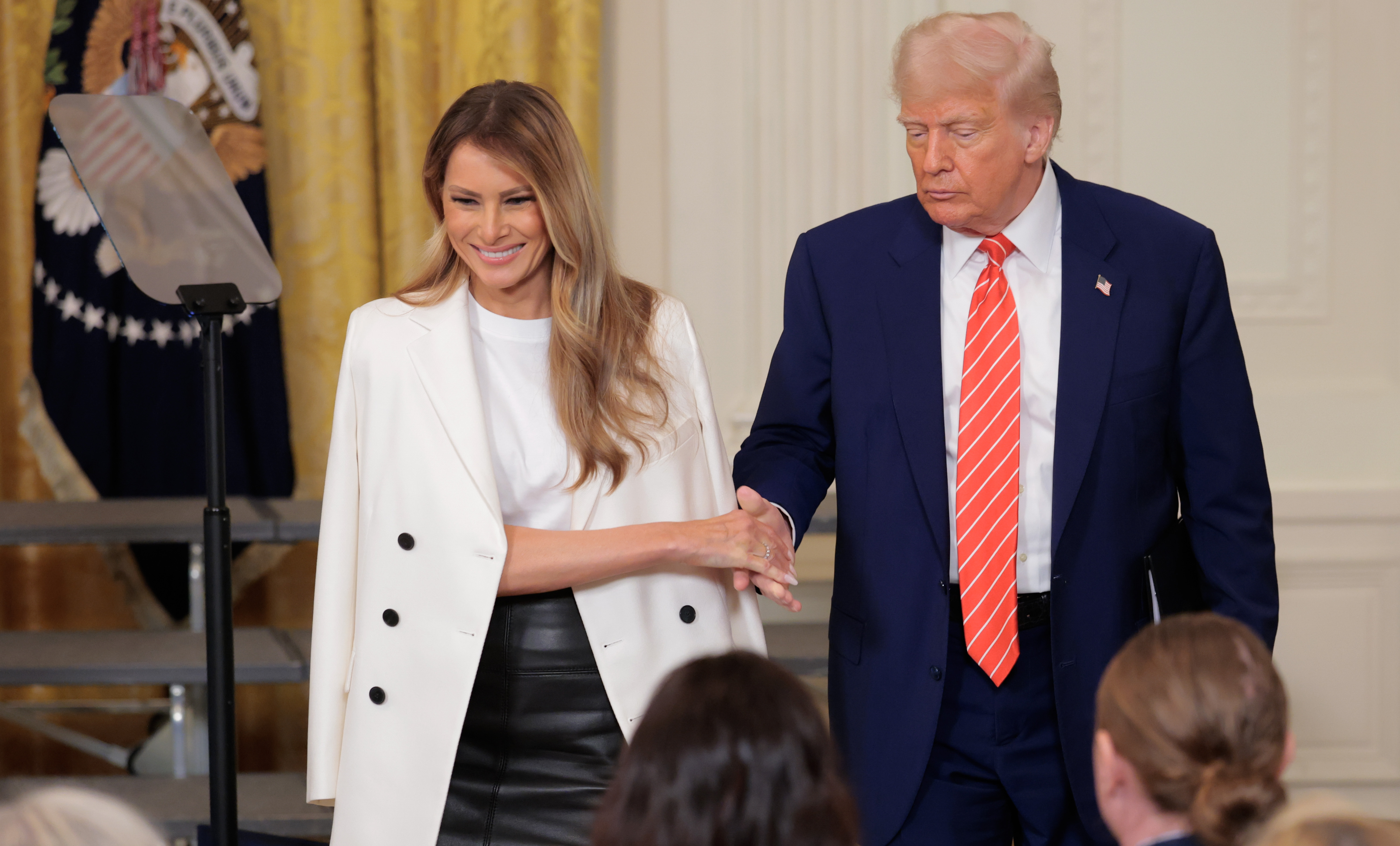 President Donald Trump and First Lady Melania Trump during an event to celebrate military mothers in the East Room of the White House on May 8, 2025 in Washington, D.C. | Source: Getty Images