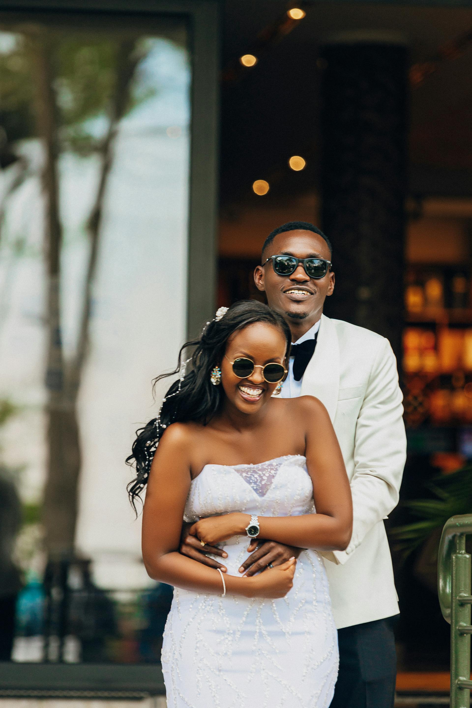 A smiling couple hugging after getting married | Source: Pexels