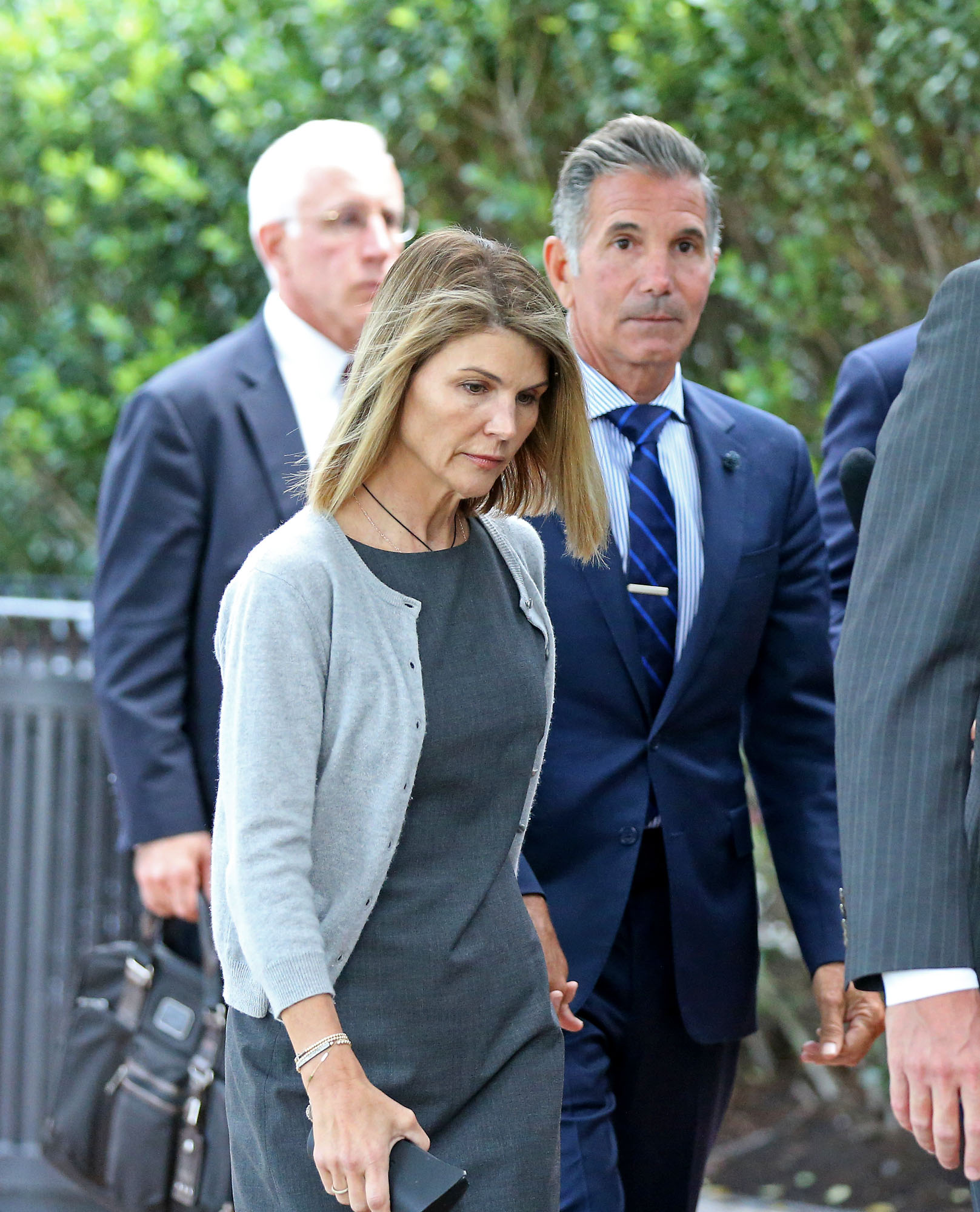 Lori Loughlin and her husband, Mossimo Giannulli, leave Moakley Federal Courthouse after a brief hearing on August 27, 2019, in Boston, Massachussetts. | Source: Getty Images