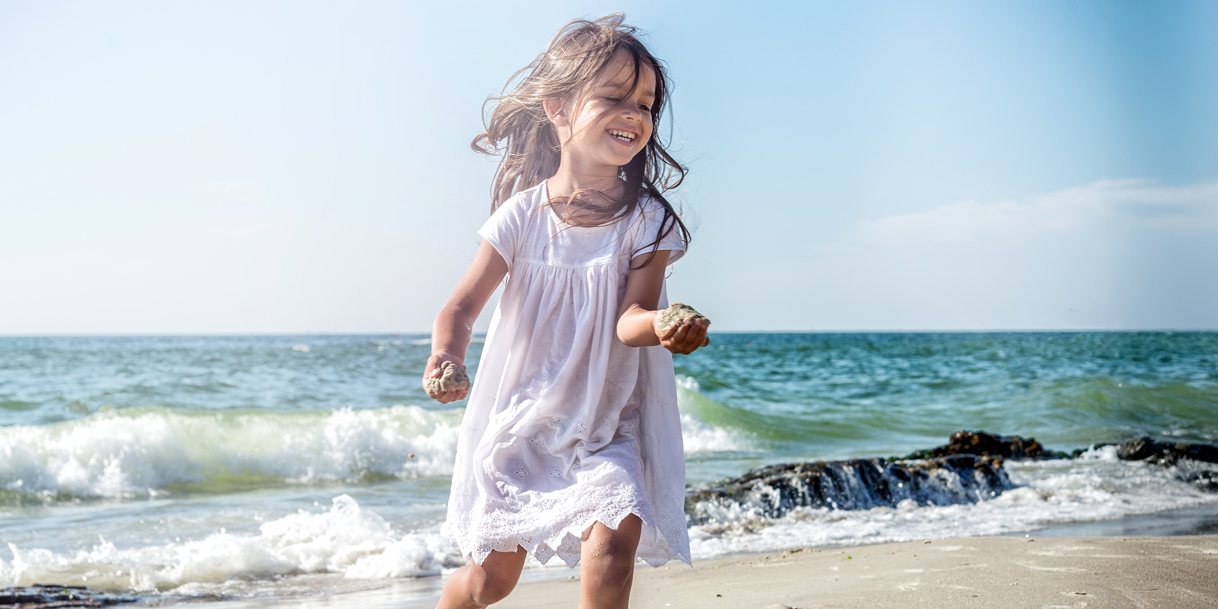 A little girl at the beach | Source: Shutterstock