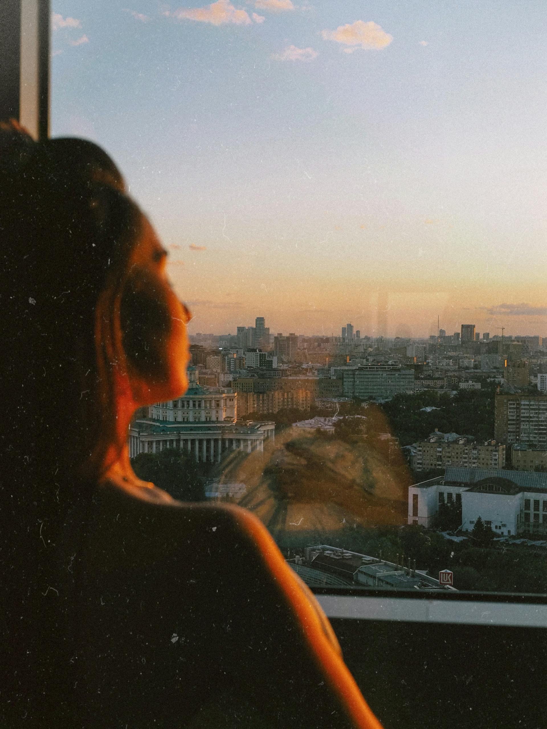 A woman looking out the window | Source: Pexels