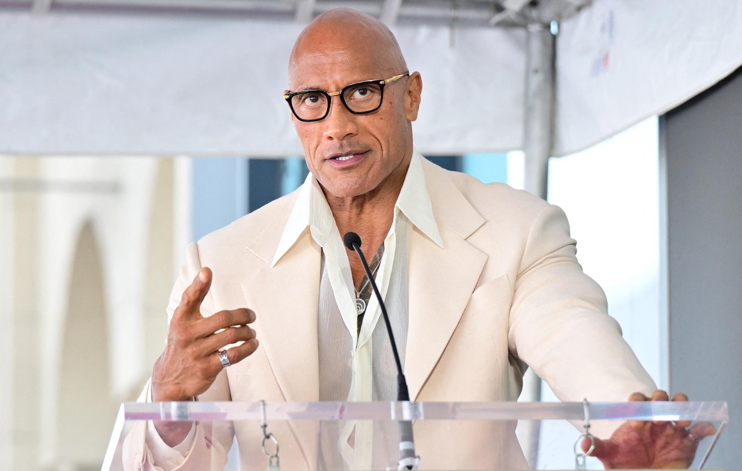 Dwayne Johnson speaks during the unveiling ceremony of US-British actress Emily Blunt and US actor Stanley Tucci's adjoining stars at the Walk of Fame in Hollywood, California on April 30, 2026. | Source: Getty Images