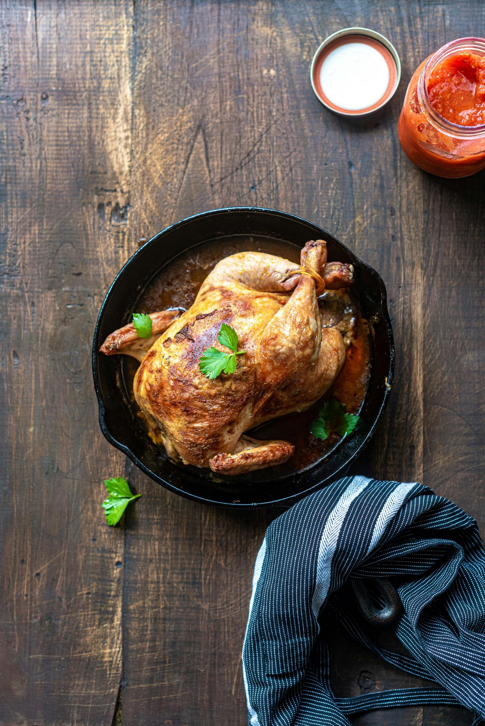 A roast chicken on a table | Source: Unsplash