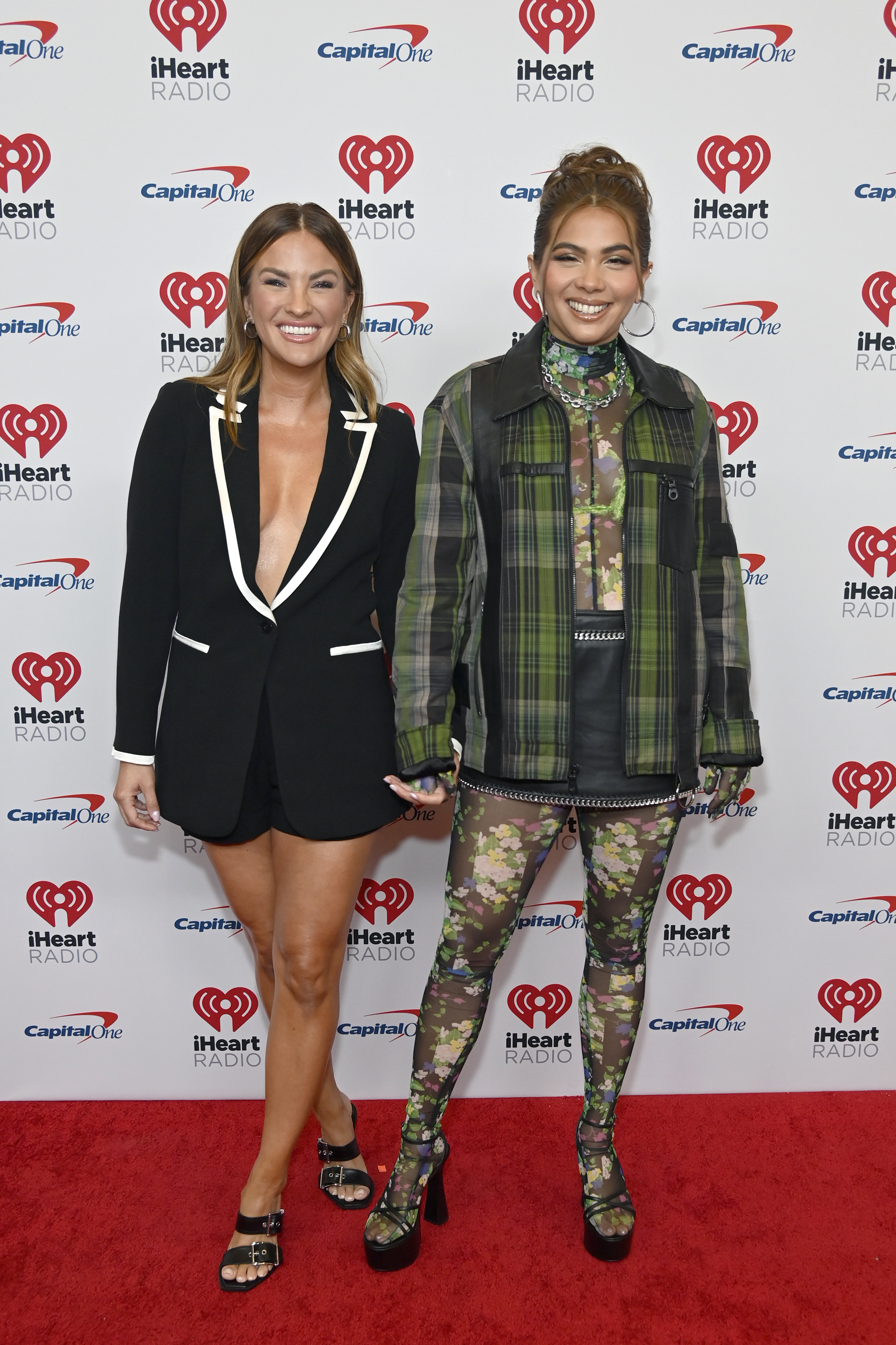 Becca Tilley and Hayley Kiyoko arrive at the 2022 iHeartRadio Music Festival at T-Mobile Arena on September 24, 2022 in Las Vegas, Nevada. | Source: Getty Images