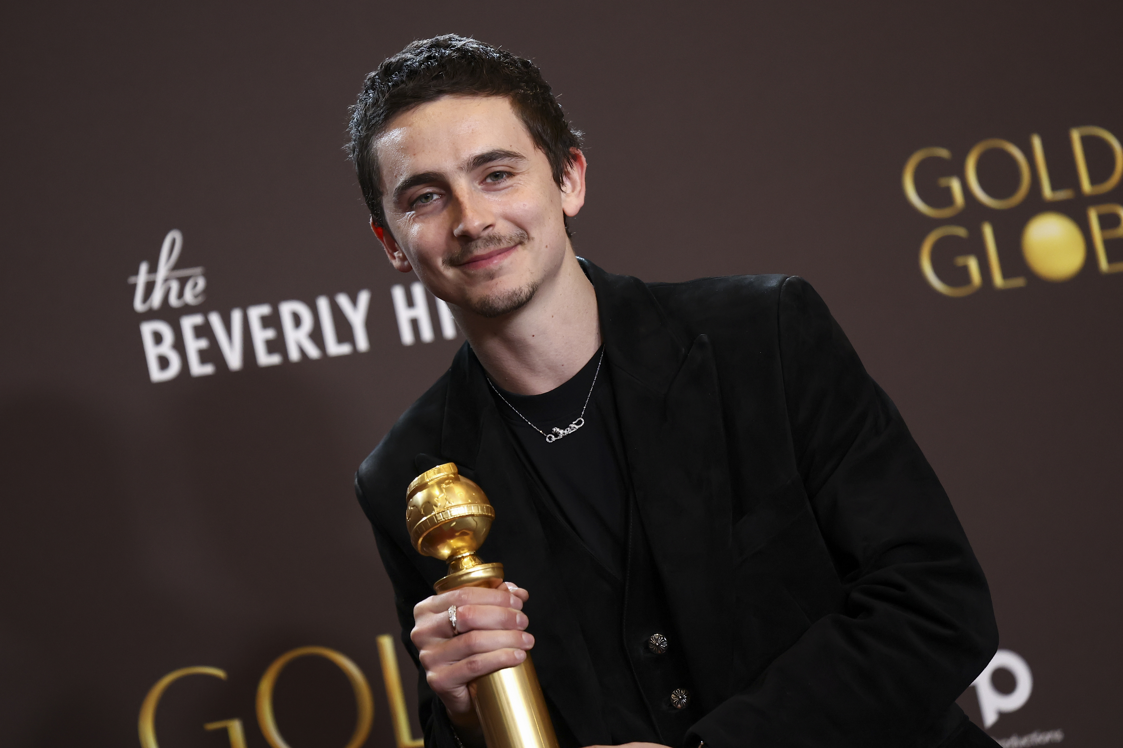 Timothée Chalamet wins the Golden Globe for male actor in a musical or comedy film for "Marty Supreme" at the 83rd Annual Golden Globes held at The Beverly Hilton on January 11, 2026 in Beverly Hills, California. | Source: Getty Images